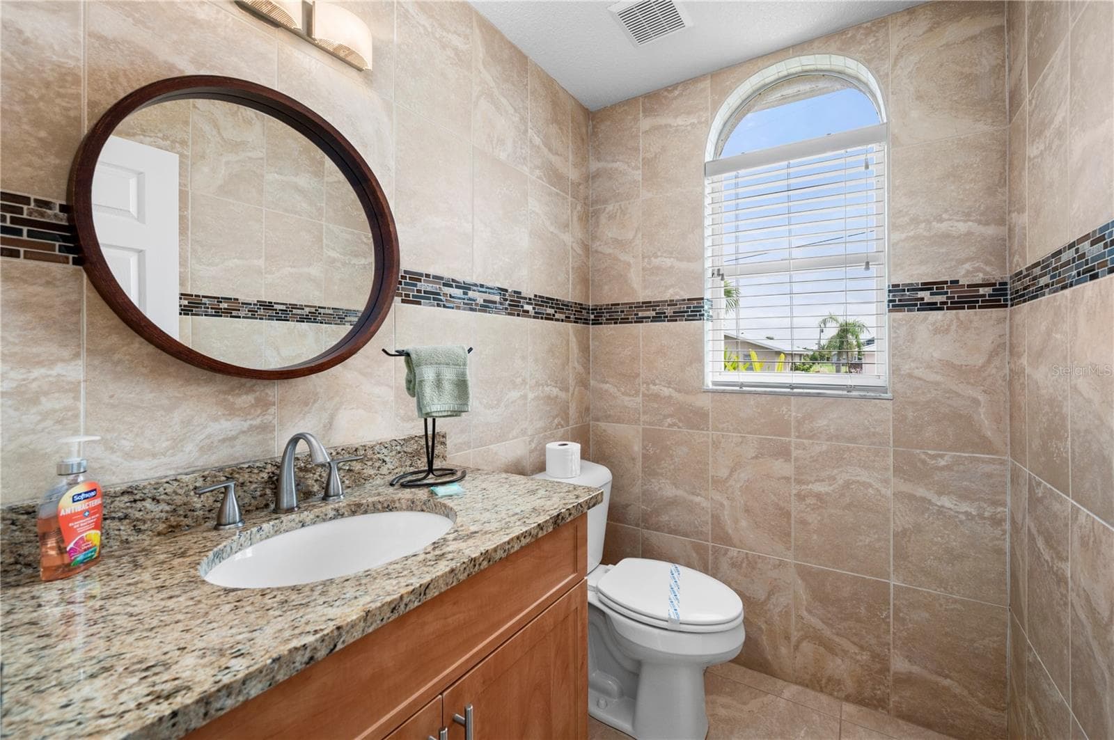 Half bath adjacent to living area - 265 BELVEDERE CT, PUNTA GORDA