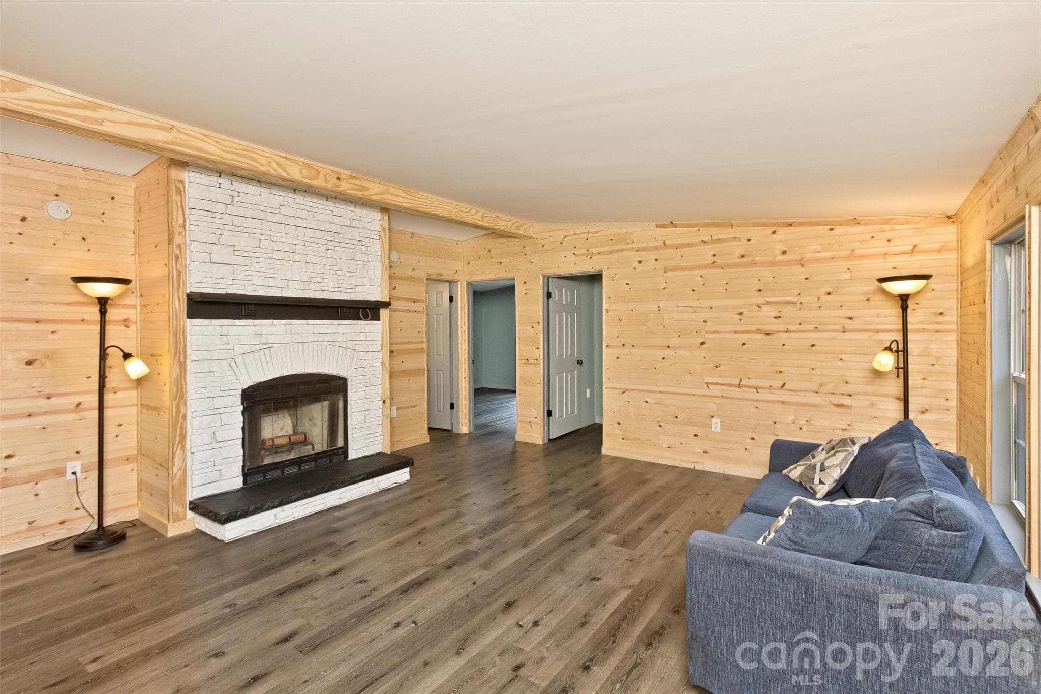 New natural knotty pine walls throughout the living room, wood-burning fireplace - 25 Asa Court, Black Mountain