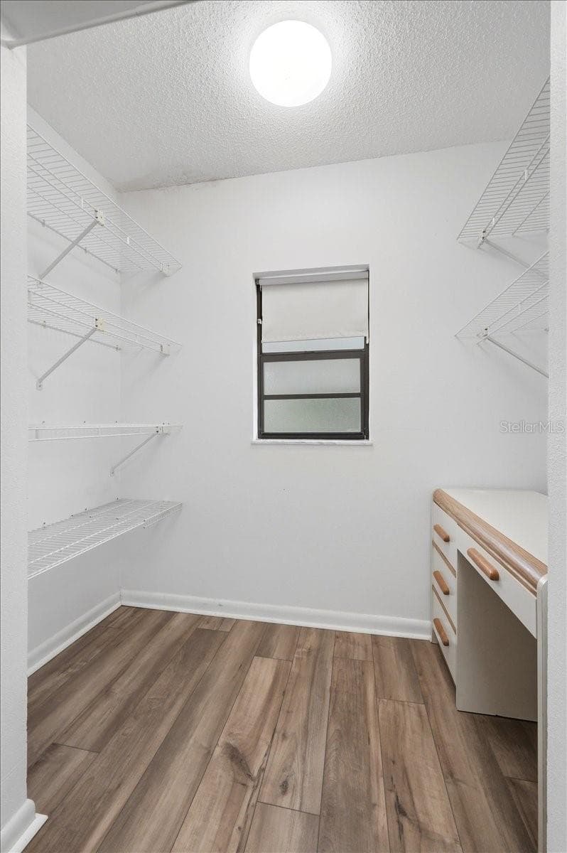 Primary bedroom walk-in closet - 3231 BEAR CREEK LN, LAKELAND