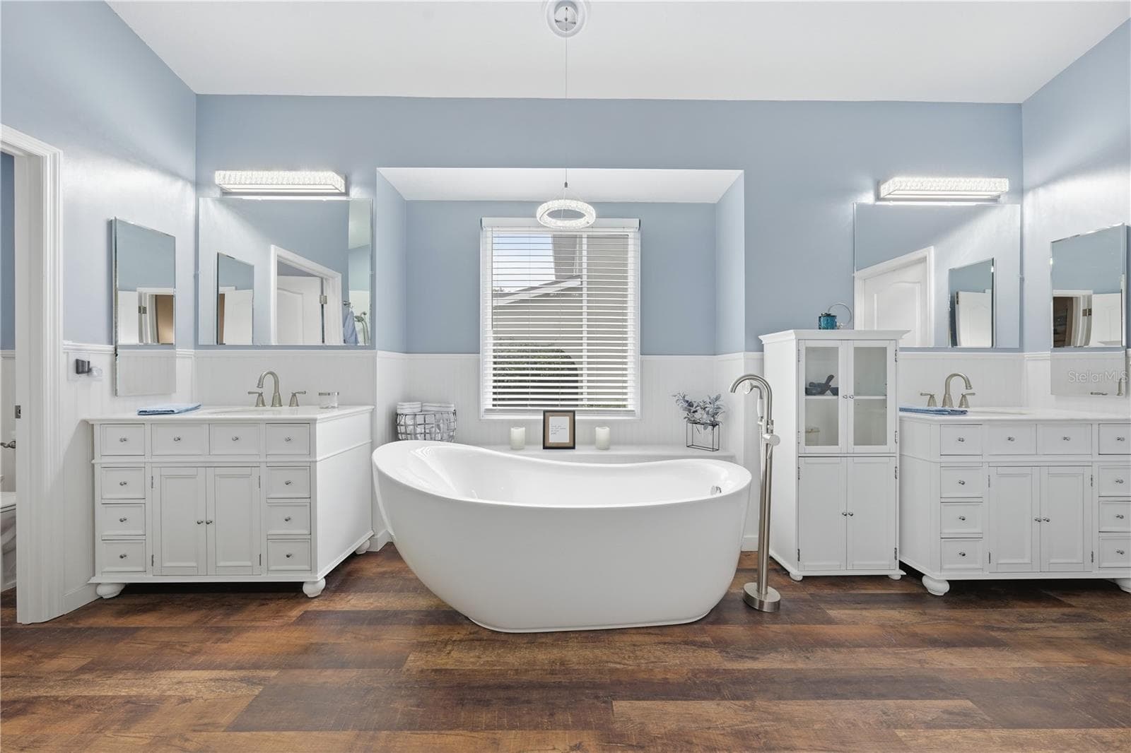 Unwind in the luxurious freestanding soaking tub after a long day. - 2360 PARK FOREST BLVD, MOUNT DORA