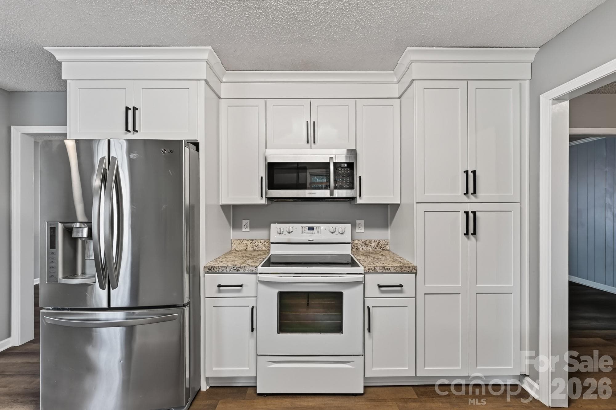 The stove has been updated with a stainless steel stove! - 1620 Windyrush Lane, Gastonia