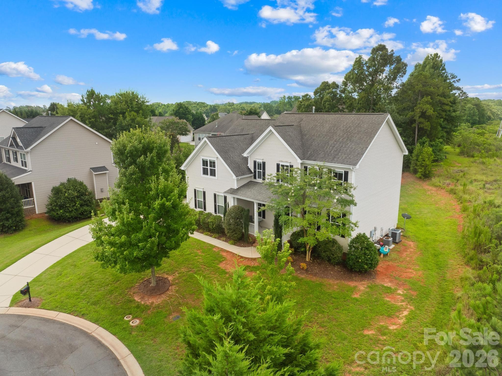 This property features a desirable corner lot location situated on a quiet cul-de-sac - 1004 Hawker Road, Matthews