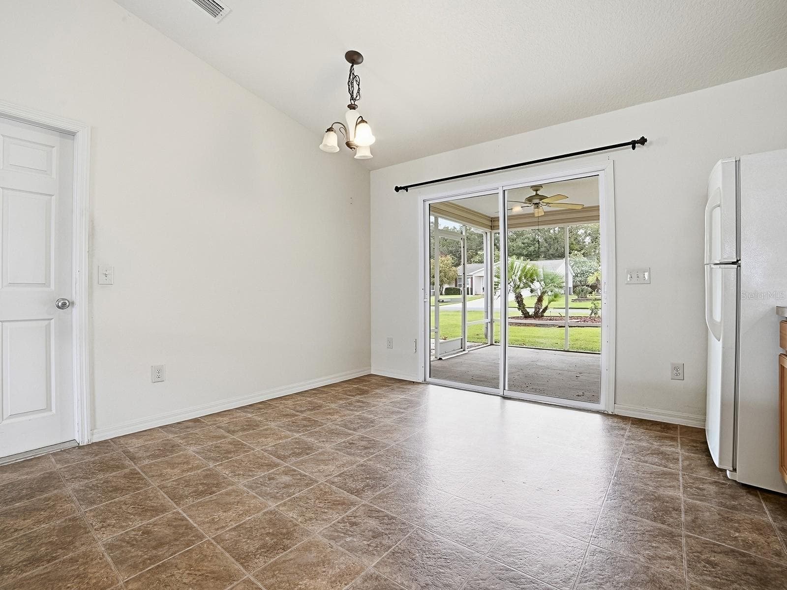 View outside lanai on corner lot. - 250 ARBELLA LOOP, THE VILLAGES