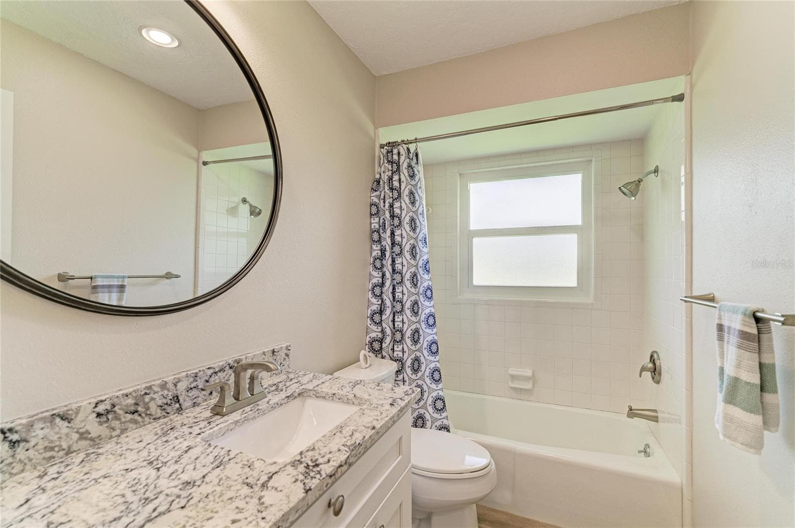 Updated guest bathroom with granite counter. - 2011 37TH ST W, BRADENTON
