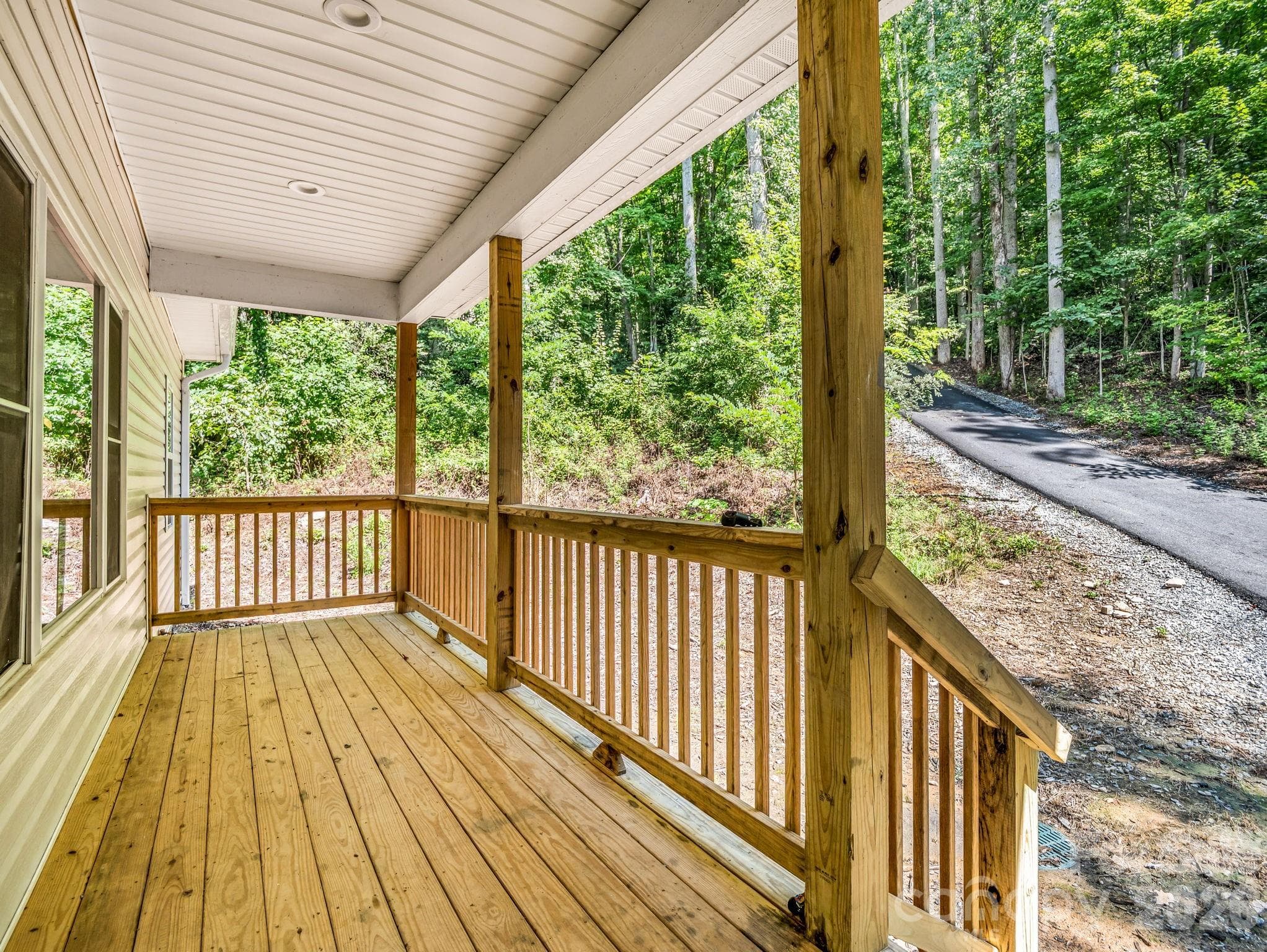 Front porch looking up the driveway toward Ridgeview Drive. - 180 Ridgeview Drive, Hendersonville