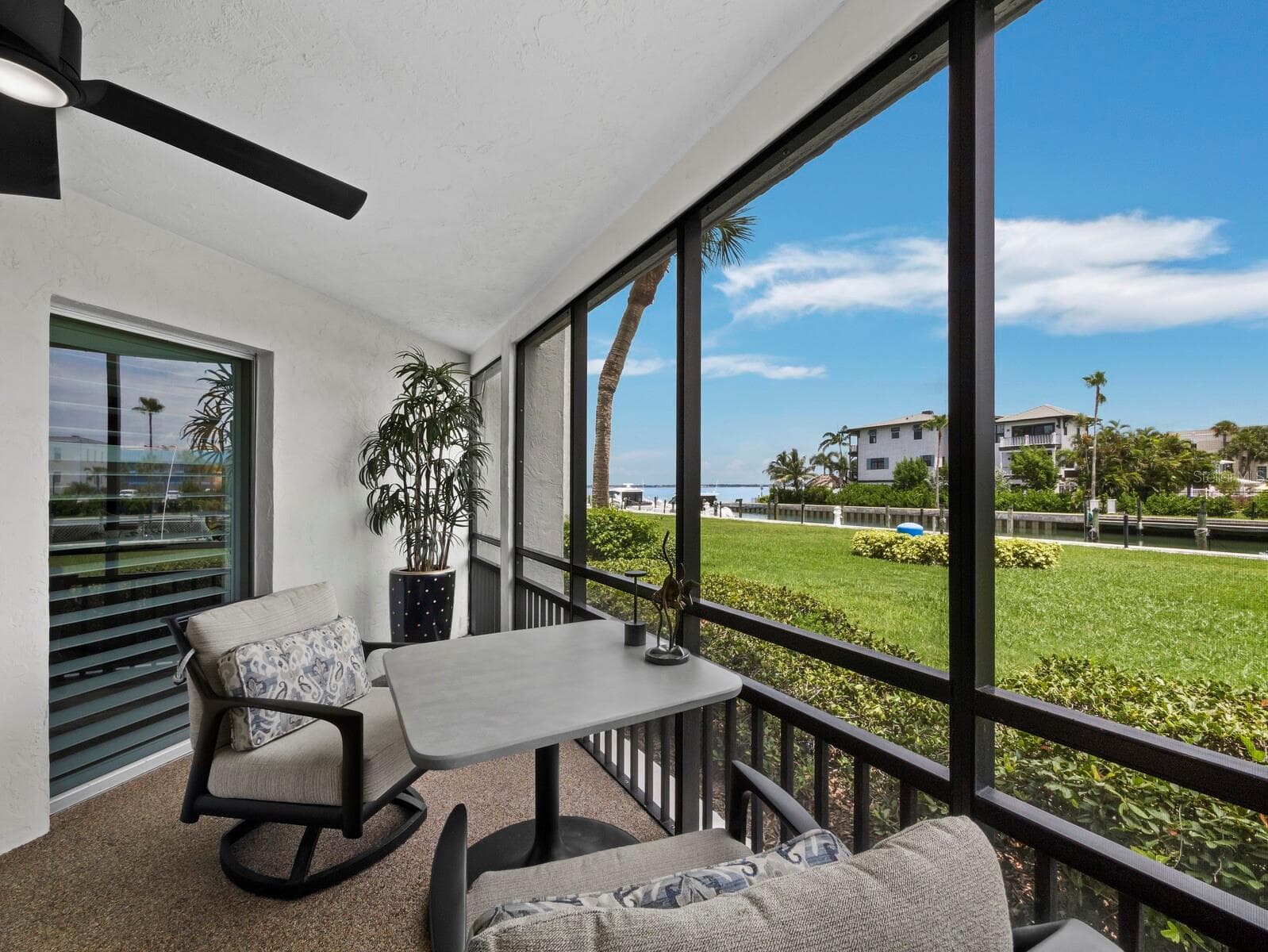 Screened in Lanai overlooking the marina - 448 GULF OF MEXICO DR #A104, LONGBOAT KEY