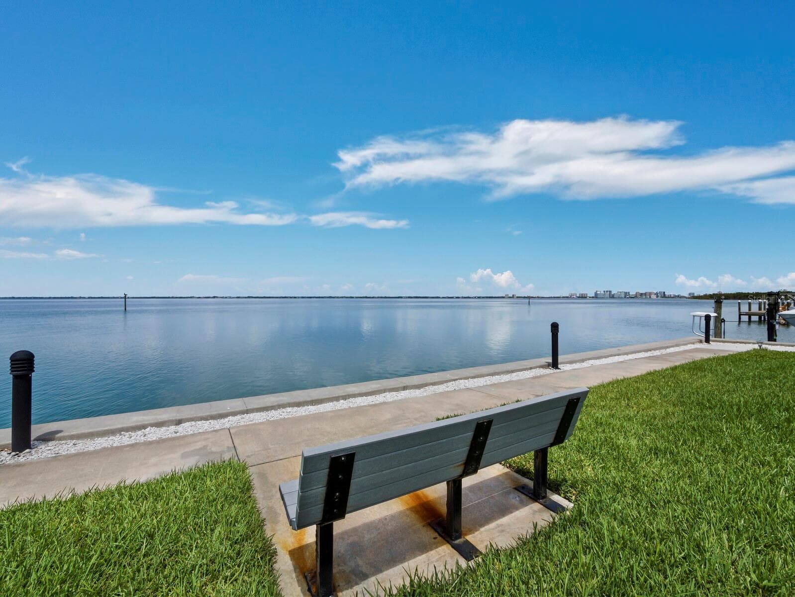 One of the bayside benches...perfect for enjoying the view, the dolphin and the jumping fish! - 448 GULF OF MEXICO DR #A104, LONGBOAT KEY