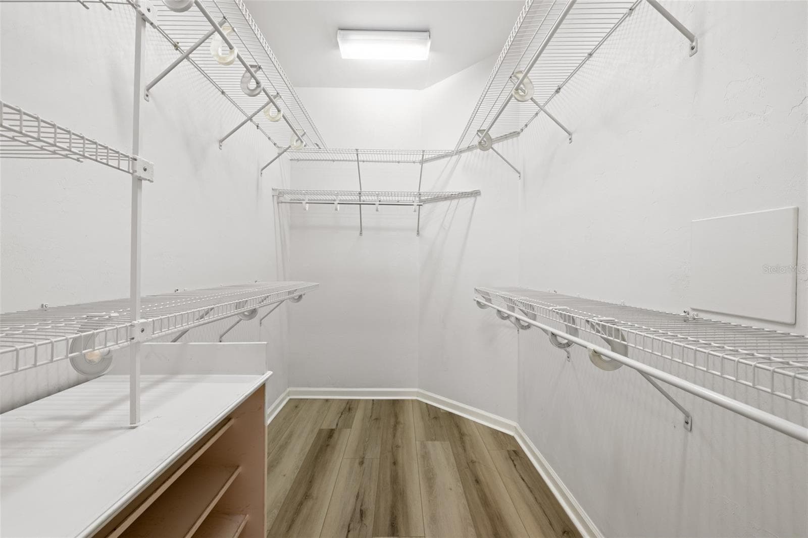large walk-in closet in primary bedroom - 3033 SW 98TH DR, GAINESVILLE