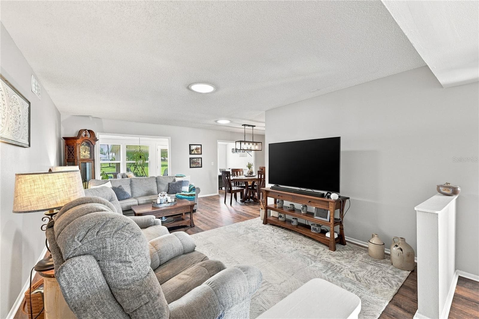 Living/Dining Combo, Large Entry Picture Window, Freshly Painted Interior, Beautiful LVT Flooring - 1405 HACIENDA DR, SUN CITY CENTER