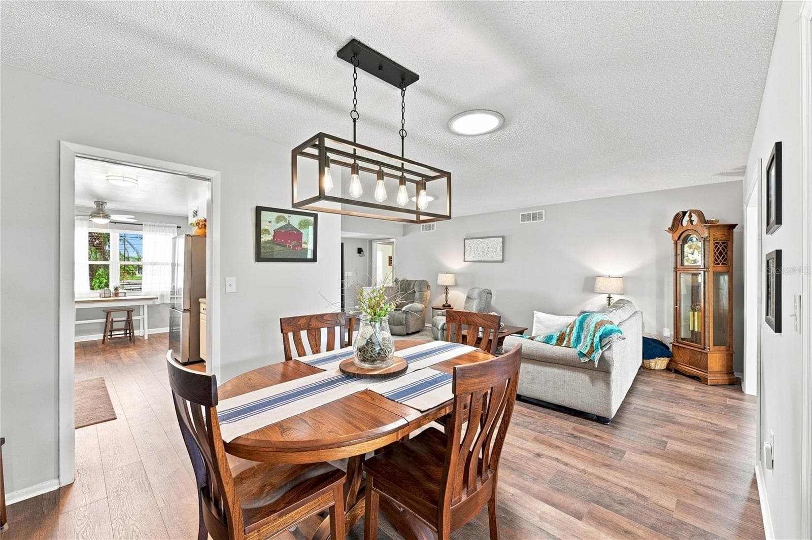 Inviting Dining/Living Combo, New Modern Fixtures & Solar Tubes - 1405 HACIENDA DR, SUN CITY CENTER