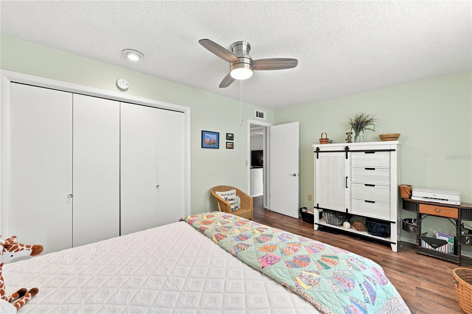 Spacious & Inviting Front Guest Room, Beautiful Laminate Oak Plank Flooring, Additional Closet Space, New Modern Fan - 1405 HACIENDA DR, SUN CITY CENTER