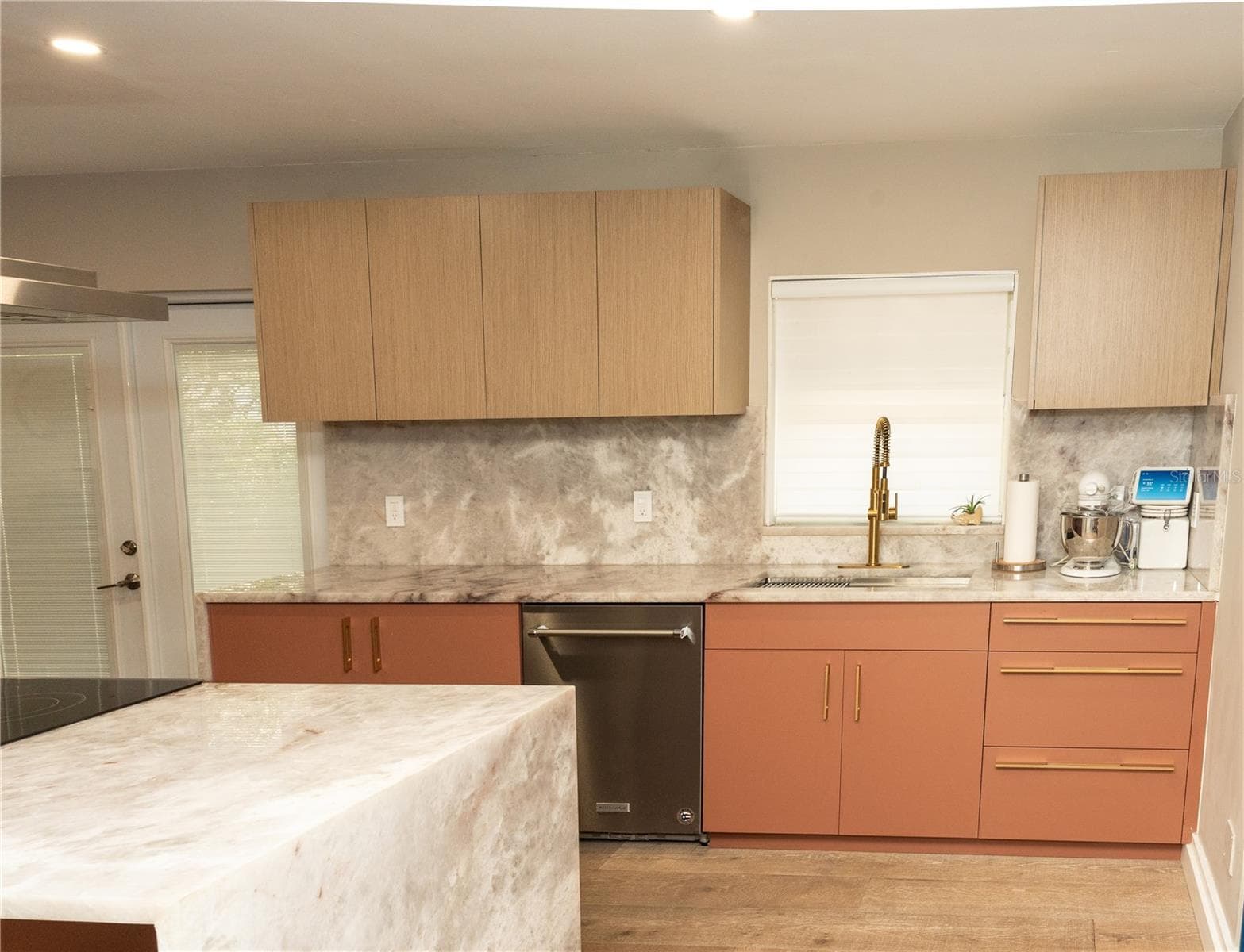 custom built cabinets back natural stone back splash. Gold finish pulls - 10740 NW 12TH MNR, PLANTATION