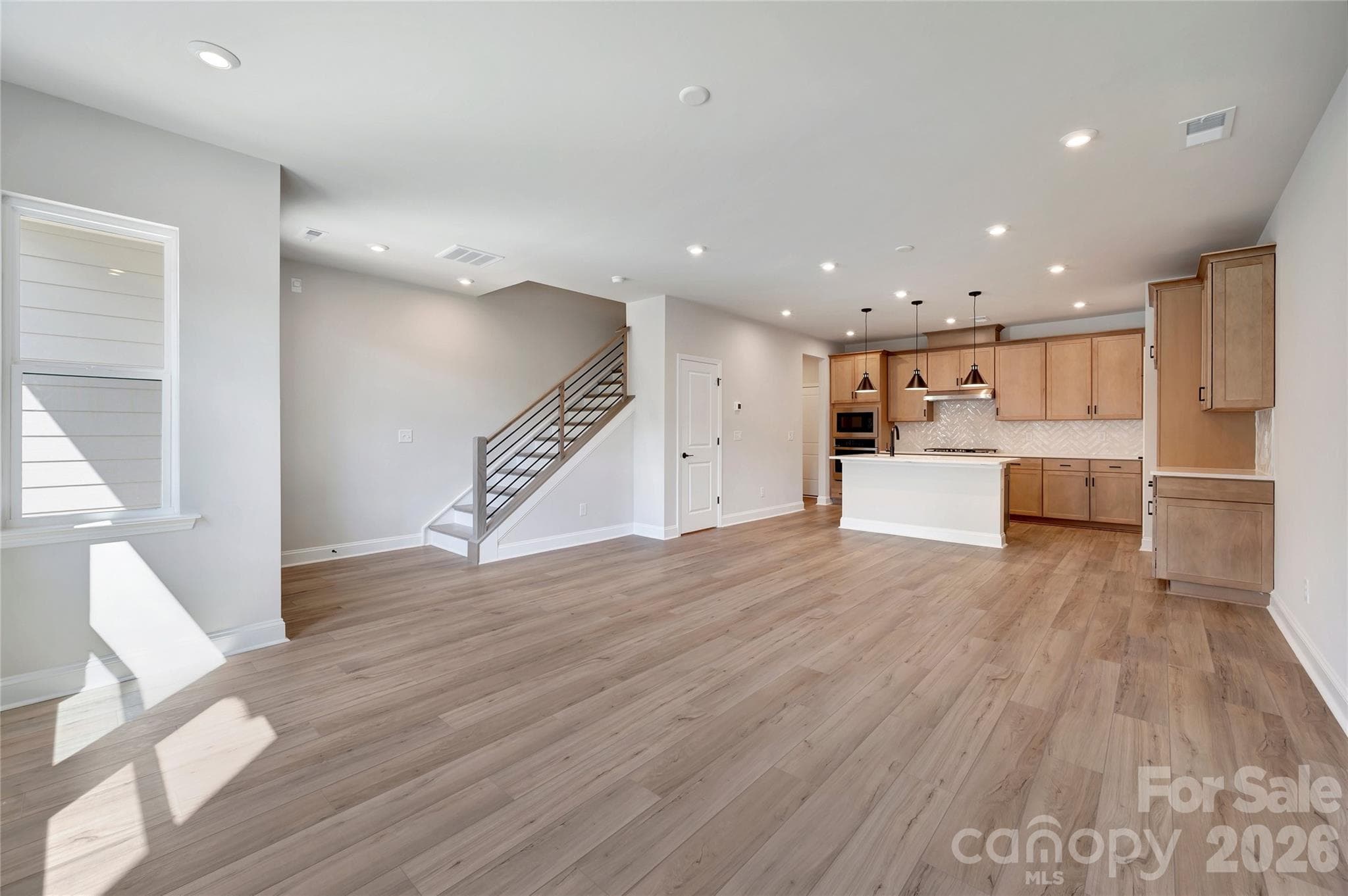 Open-Concept Living with Open Rail and Oak Box Stairs - Fort Mill