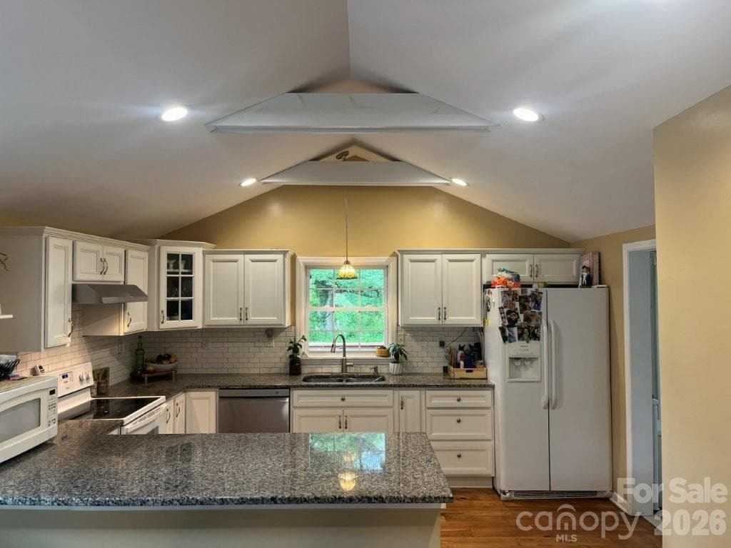 VIEW OF KITCHEN FROM DINING ROOM - 325 Ewbank Road, Etowah
