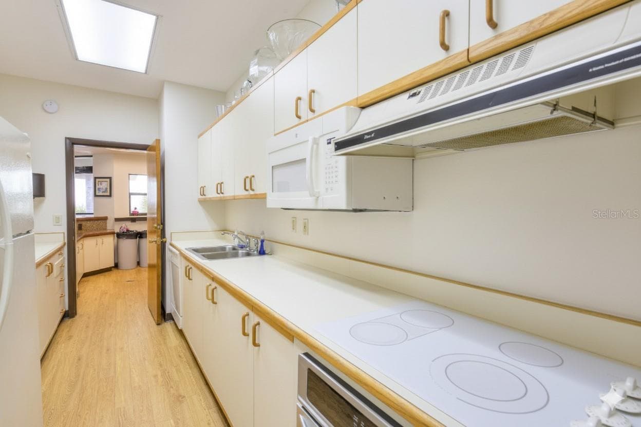 Catering kitchen for the common area parlor. - 1660 GULF BLVD #PH1, CLEARWATER BEACH