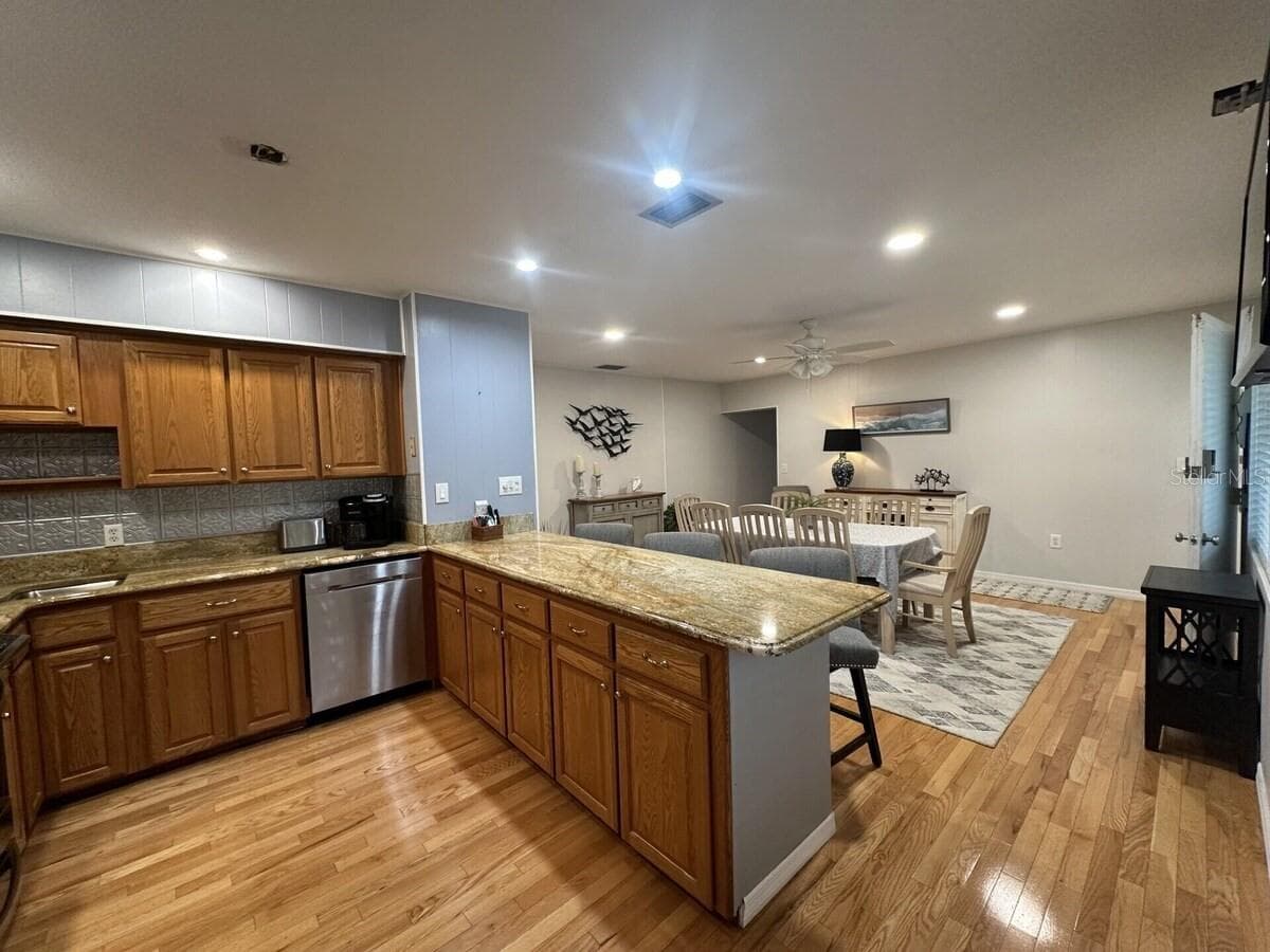 Kitchen and Island Bar with attached dinning area. - 5955 MIDNIGHT PASS RD #21E, SARASOTA