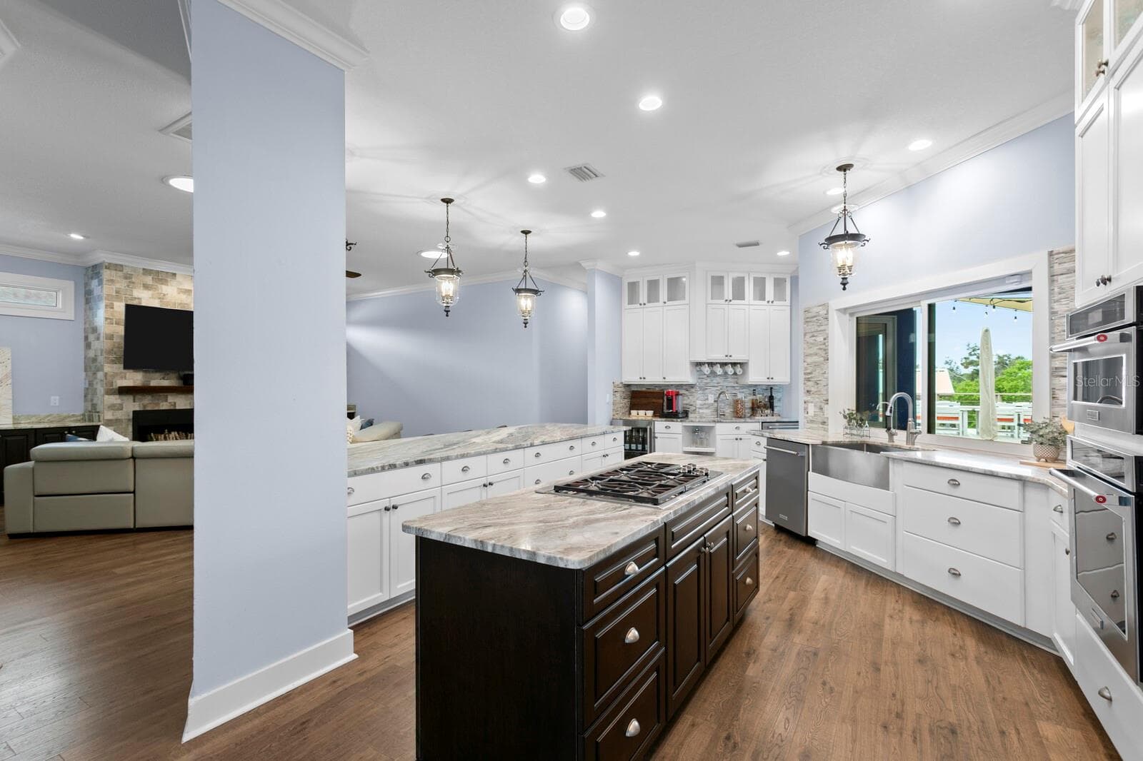 Large gourmet Kitchen with two islands and coffee/wet bar opens to Family Room - 704 EAGLE LN, APOLLO BEACH