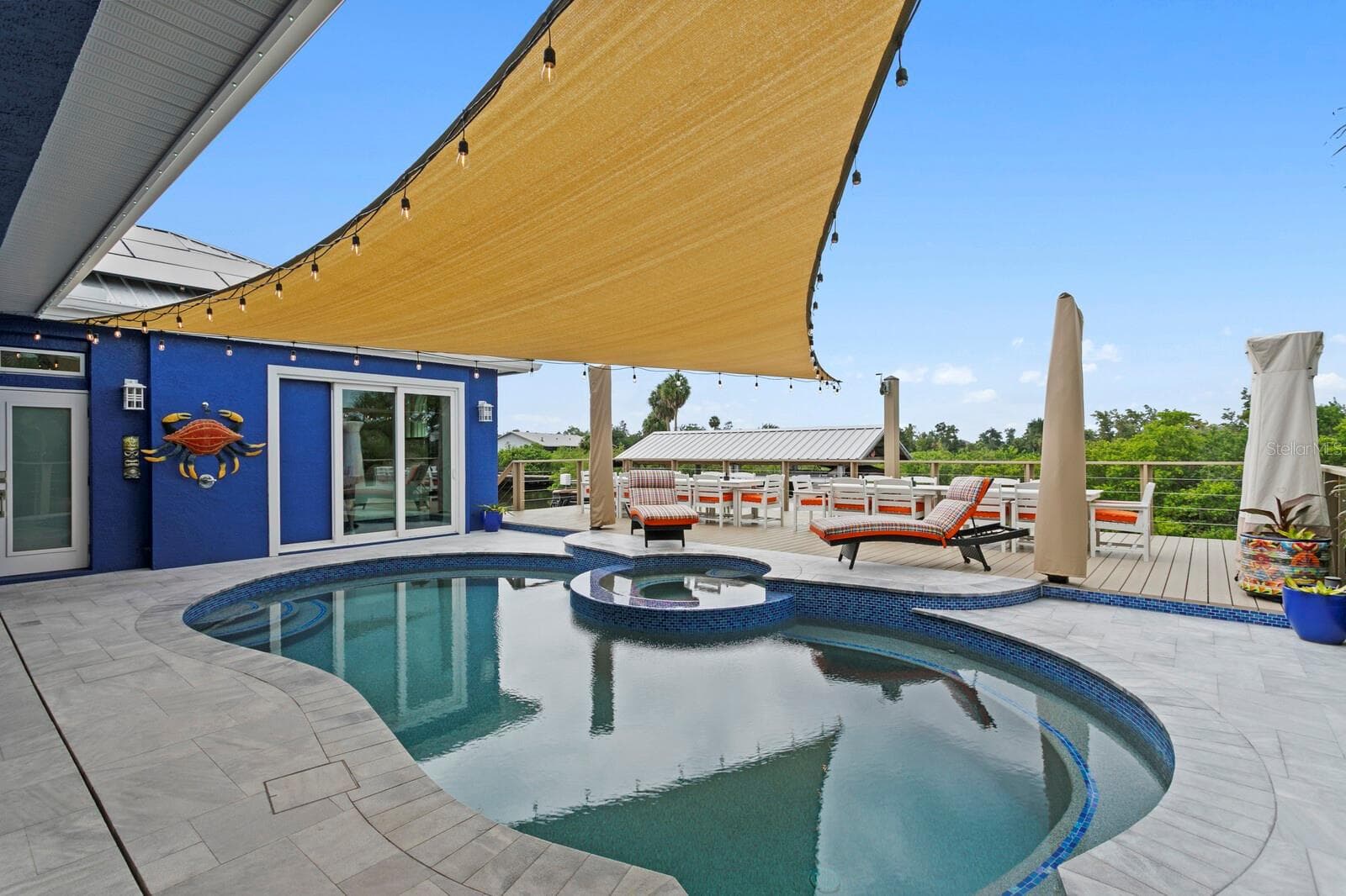 Redesigned pool features a wrap-around bench - 704 EAGLE LN, APOLLO BEACH