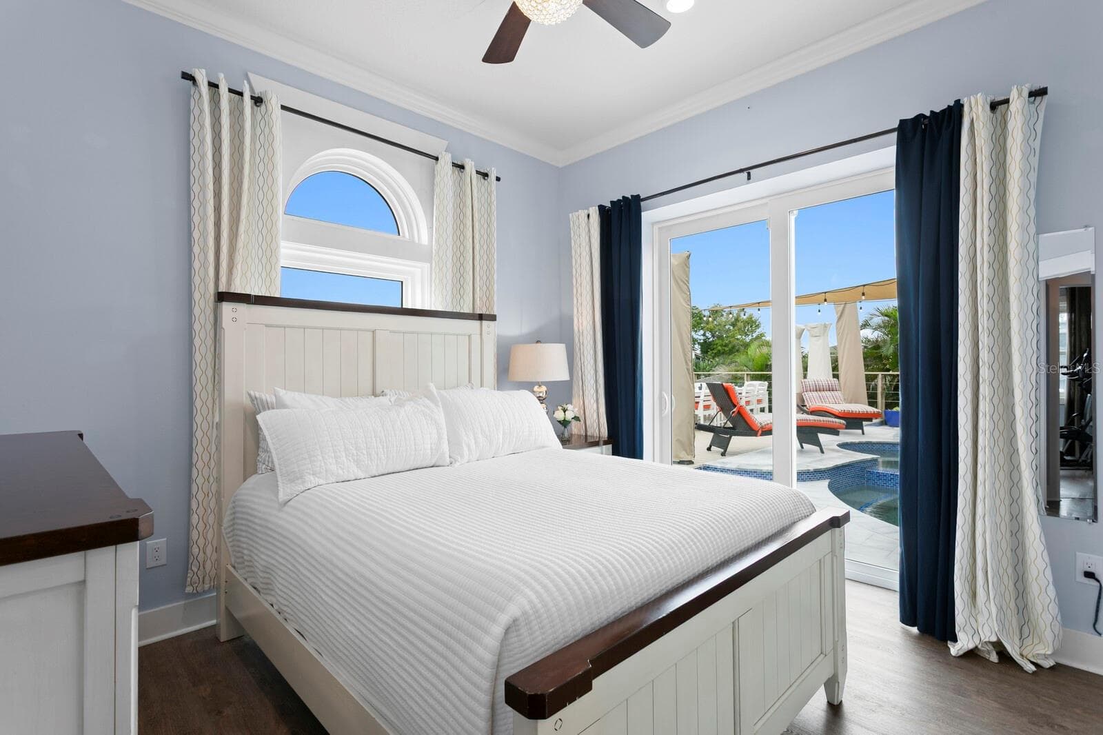 2nd bedroom with dual pocket sliding impact door leading to pool - 704 EAGLE LN, APOLLO BEACH