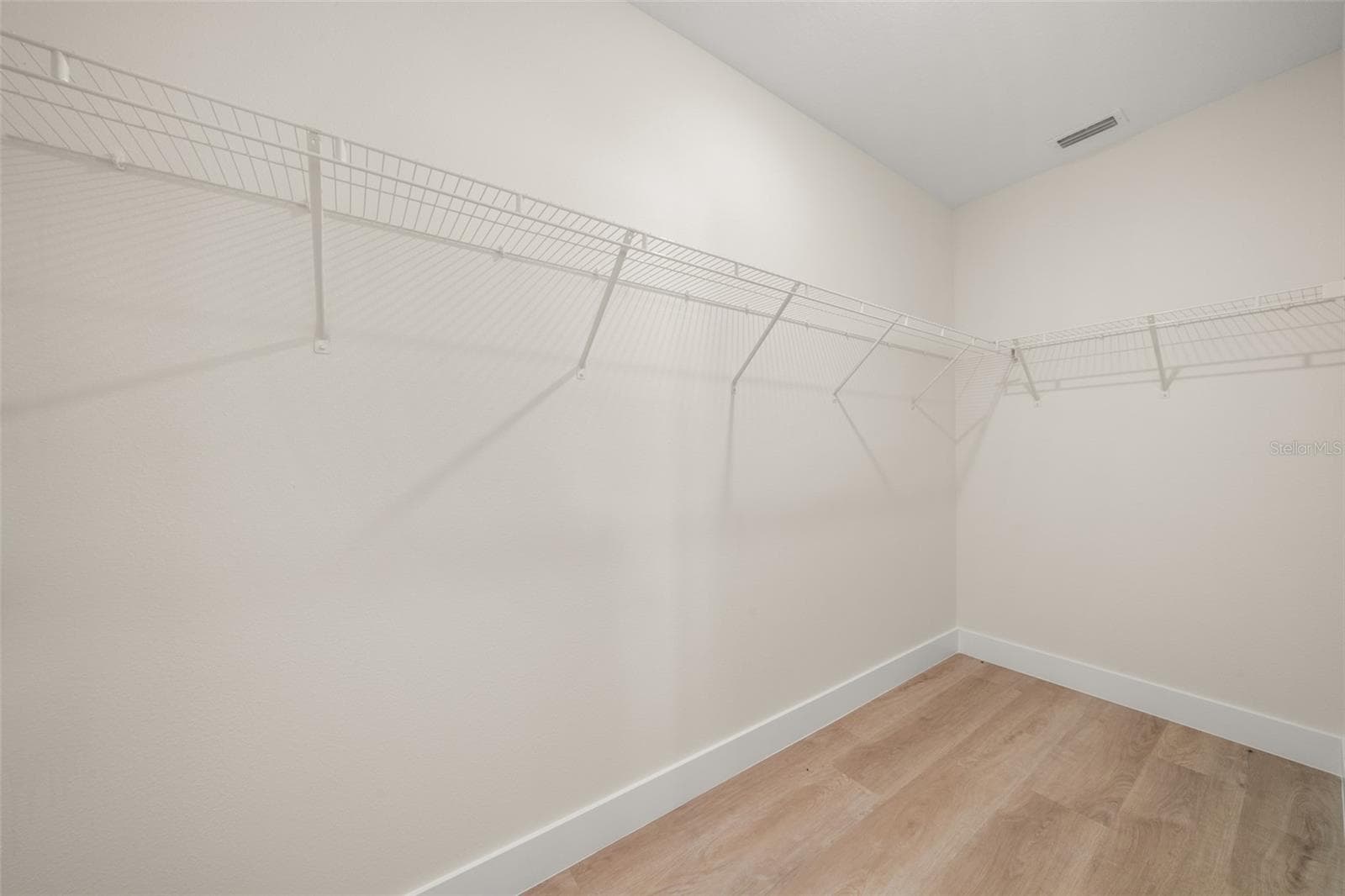 primary walk in closet - 8725 CAPILLA ST, SEBRING
