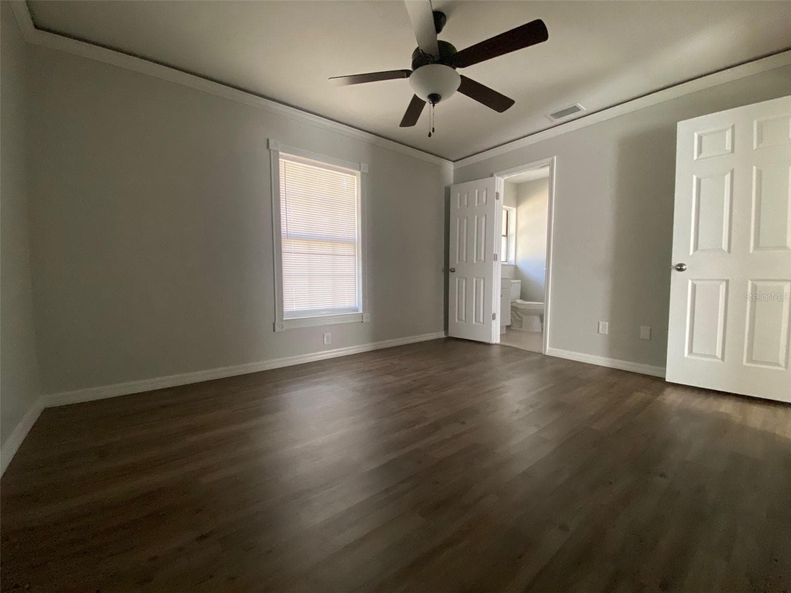Master bedroom has ambient lighting tucked behind the crown molding along with private en-suite - 11585 SE 129TH LN, OCKLAWAHA