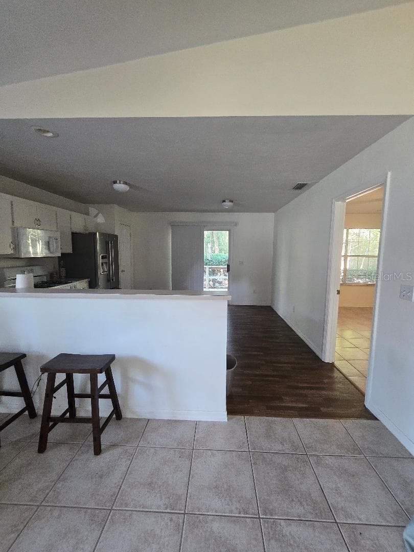 Living room to kitchen - 13607 NW 135 DR, ALACHUA