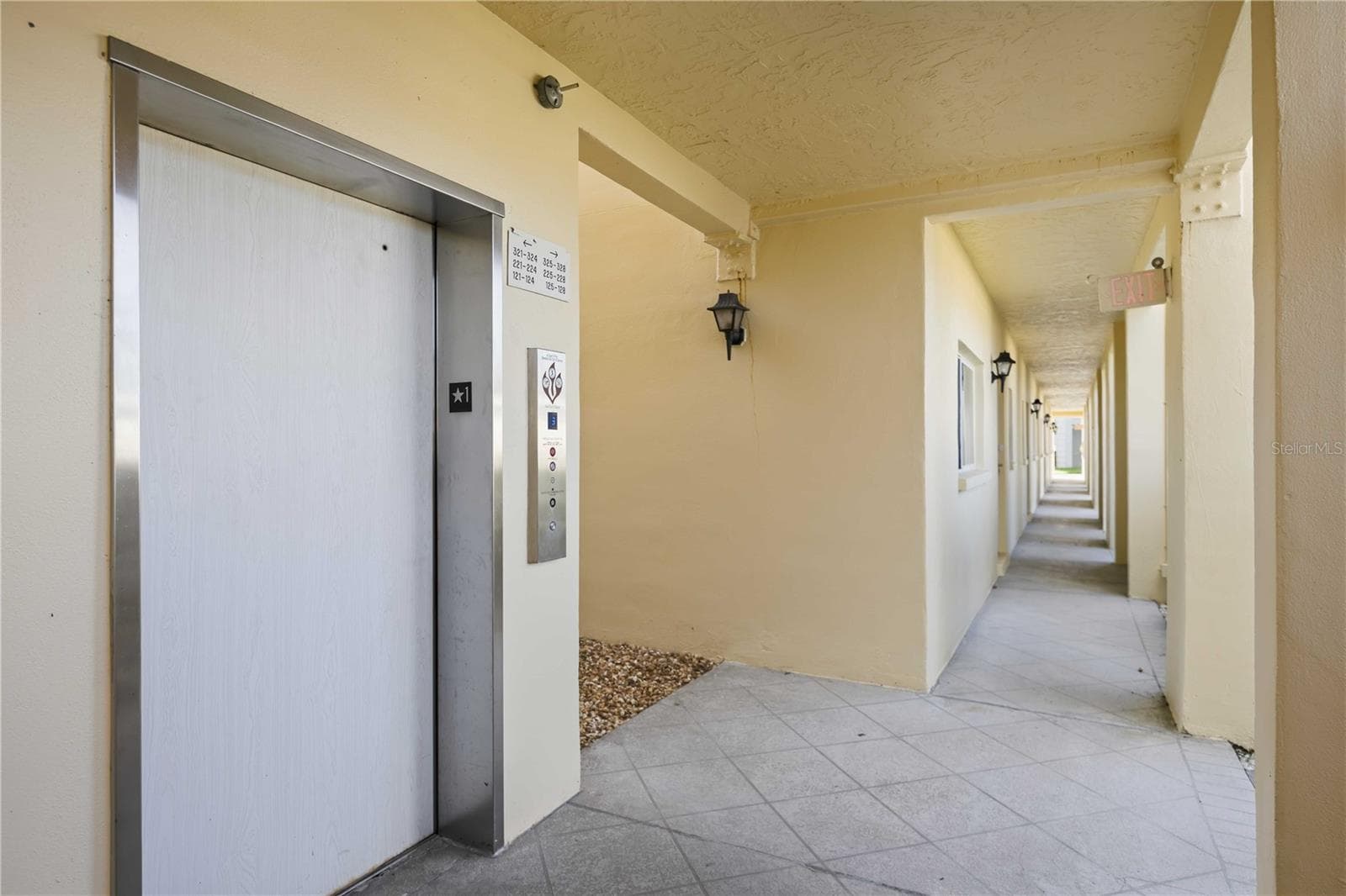 Convenient elevator access just steps from the residence along a covered walkway. - 406 CERROMAR CIR N #328, VENICE