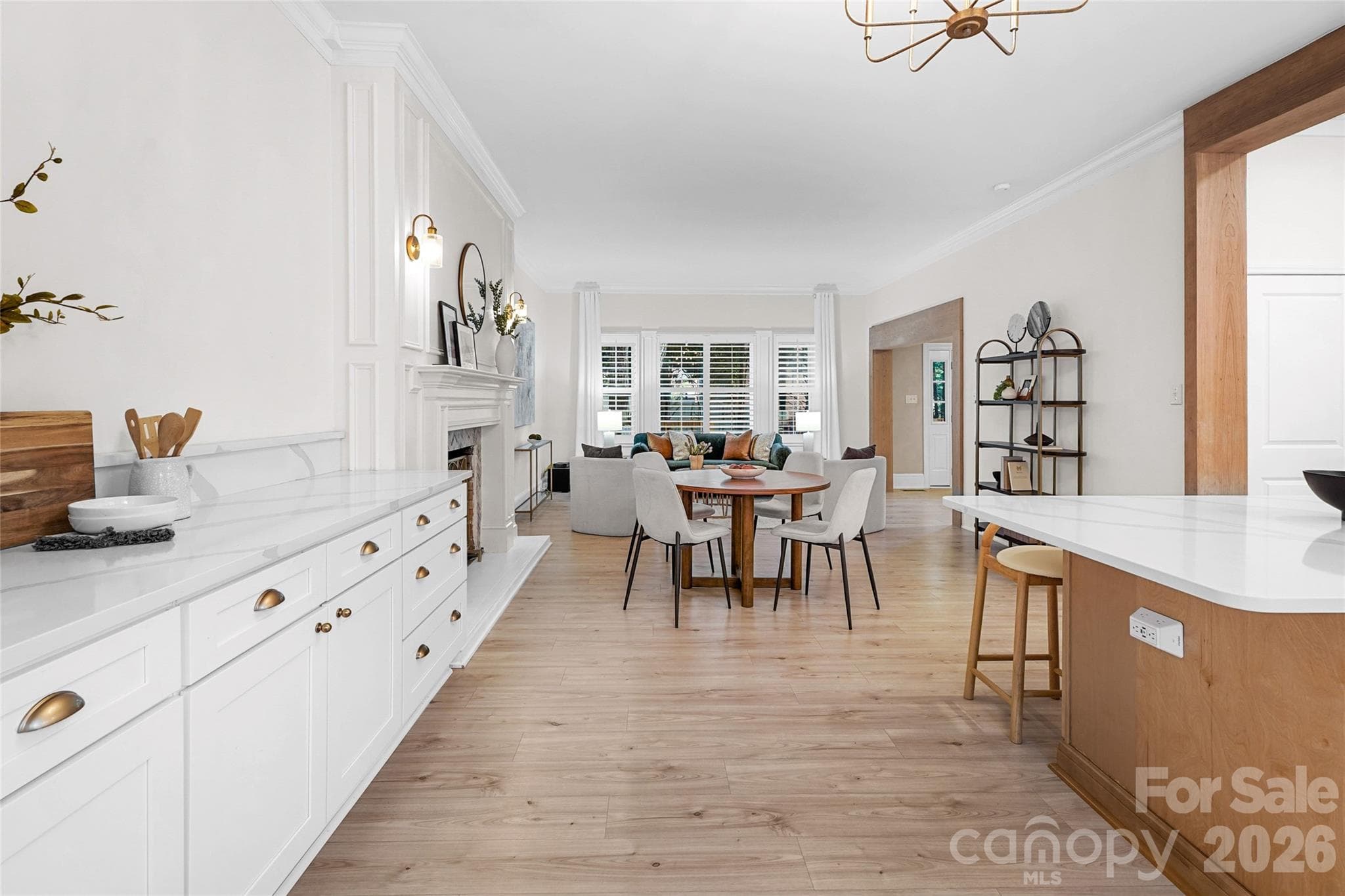 Built-in cabinetry and bar area add extra storage and entertaining space. - Charlotte