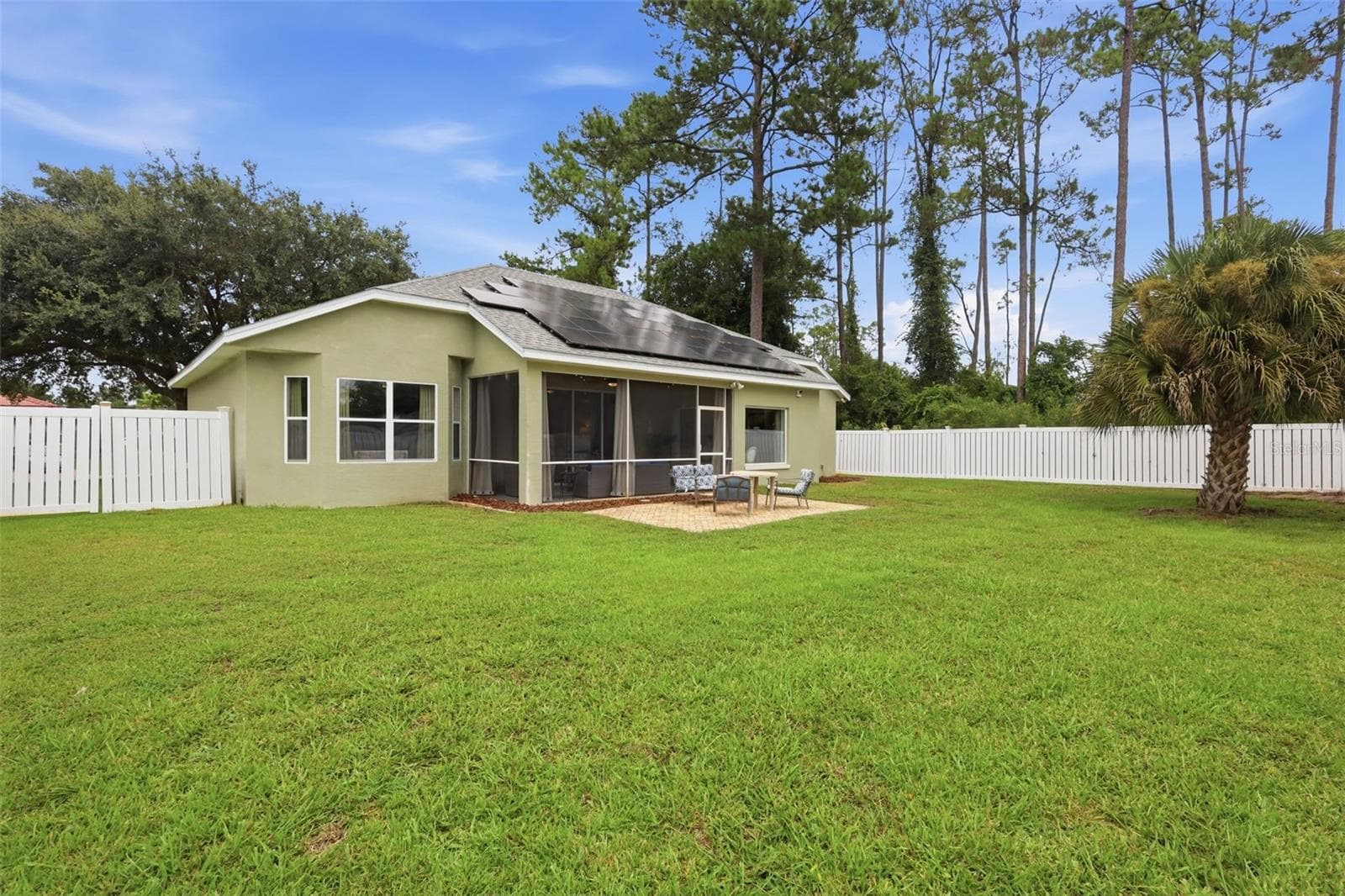 Spacious vinyl fenced backyard. Solar panels provide electric bills of around $60/mo. - 96 PARKVIEW DR, PALM COAST