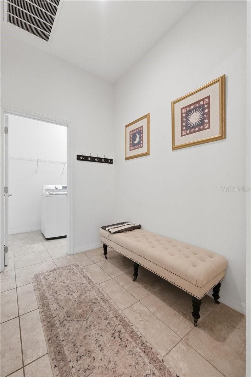 A thoughtfully designed mudroom just off the garage welcomes you home, with the laundry room to one side and direct access into the heart of the home on the other. - 4791 RIVERWALK DR, ST CLOUD