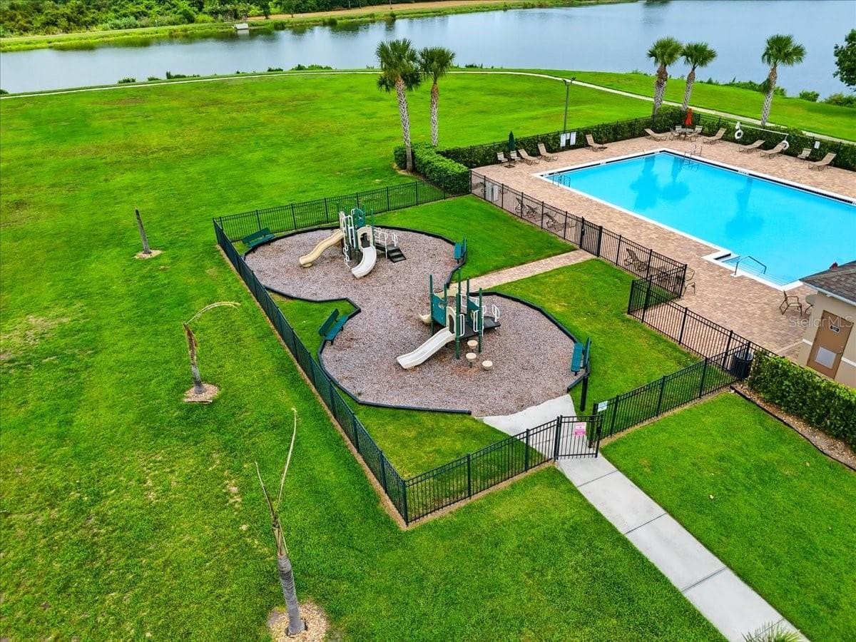 Beyond the pool, enjoy a complete recreation setting with a playground, pavilion and open green space, walking trails... all just moments from home. - 4791 RIVERWALK DR, ST CLOUD