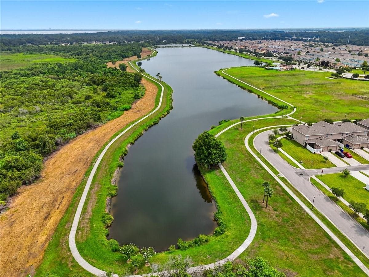 Scenic lakes and winding trails weave through the community, bringing a sense of nature and open space to everyday life. - 4791 RIVERWALK DR, ST CLOUD