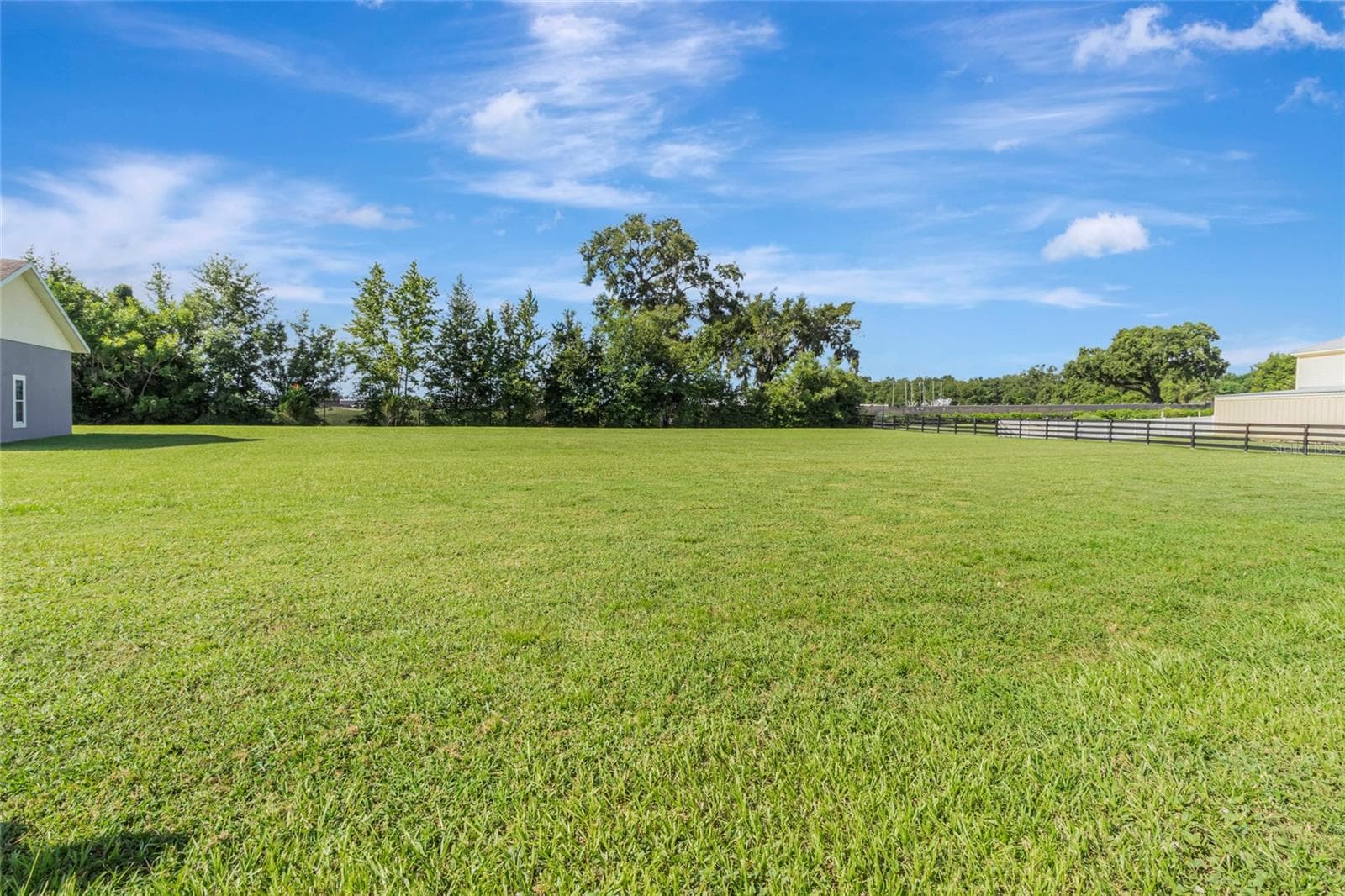 Large estate with fully fenced in back yard - 4190 COUNTY ROAD 121D, WILDWOOD