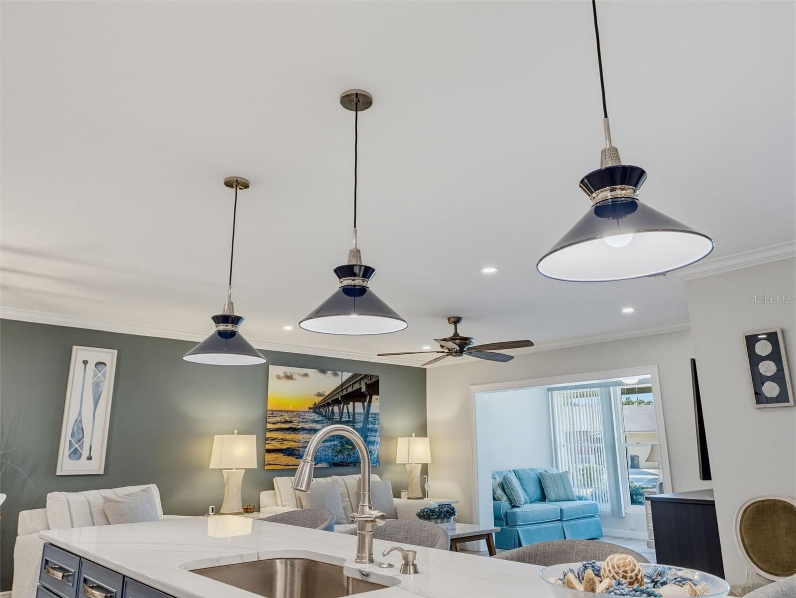 Accentuating blue pendant island lights - 1372 CARLISLE CT, DUNEDIN