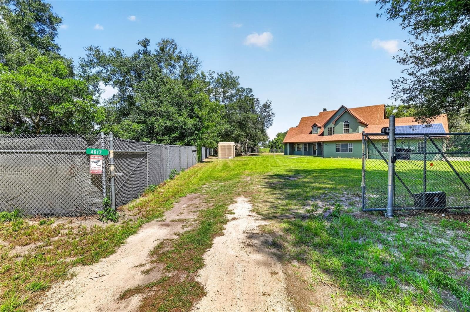 Gated access provides added privacy and security on this expansive rural property. - 4617 ROUND LAKE RD, APOPKA