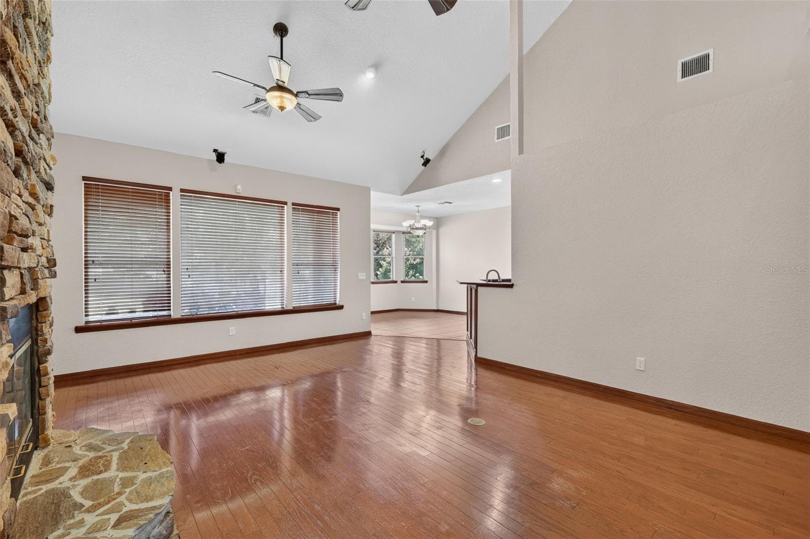 An open concept layout connects the living room seamlessly to the kitchen, perfect for entertaining or keeping family close. - 4617 ROUND LAKE RD, APOPKA
