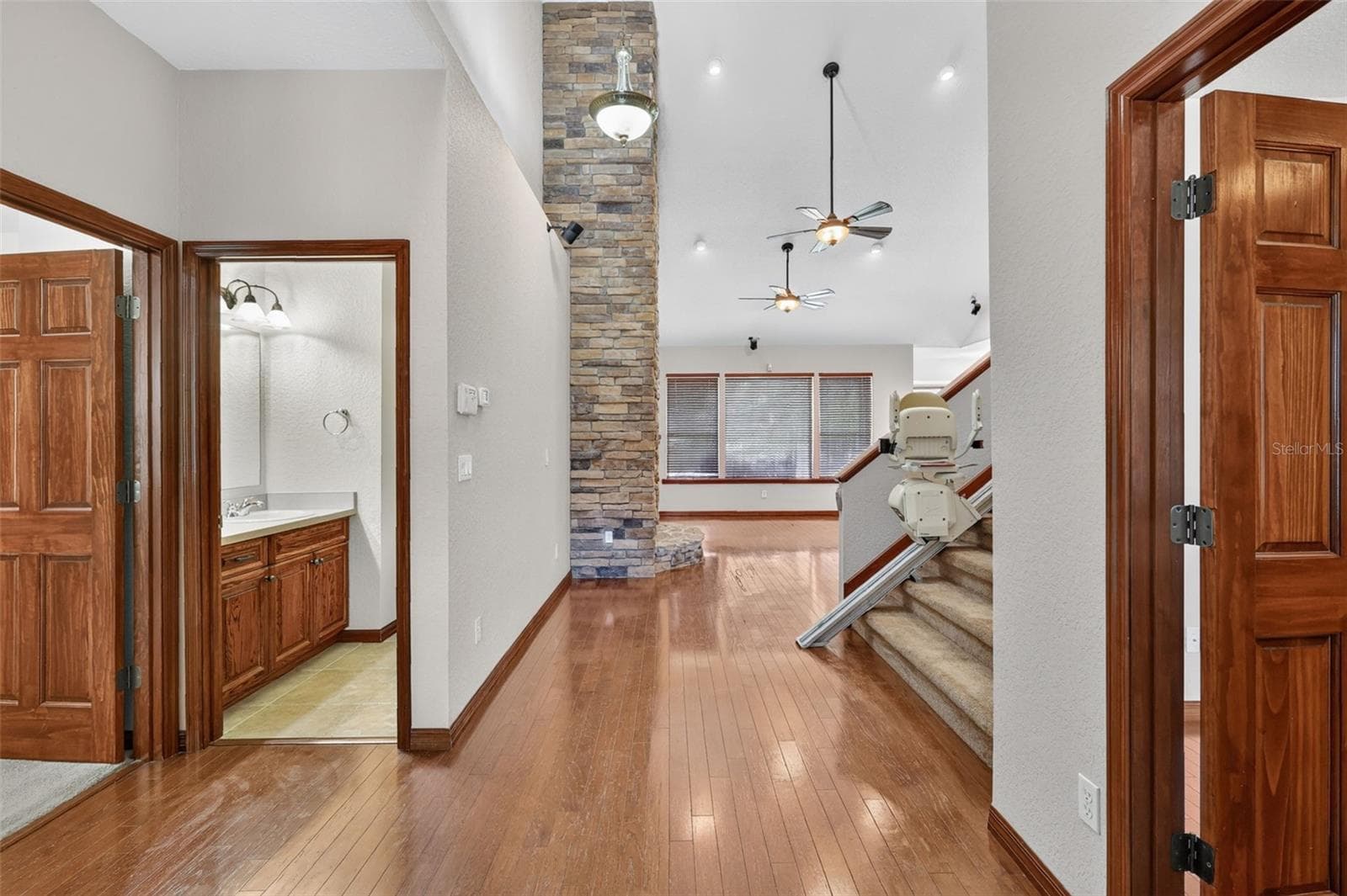 A thoughtfully designed floor plan with easy first-floor access, hardwood floors throughout, and a convenient half bath just steps from the main living area. - 4617 ROUND LAKE RD, APOPKA