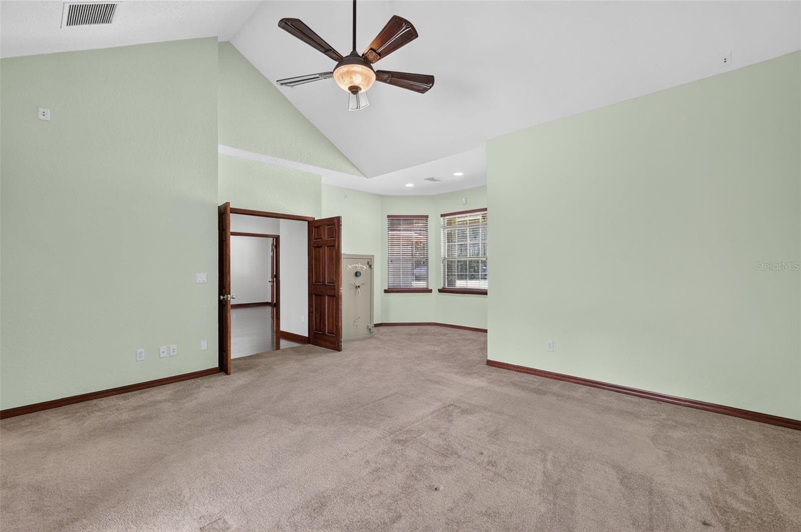 Spacious enough for any furniture arrangement, the primary bedroom offers a cozy window nook perfect for a reading chair or vanity. - 4617 ROUND LAKE RD, APOPKA