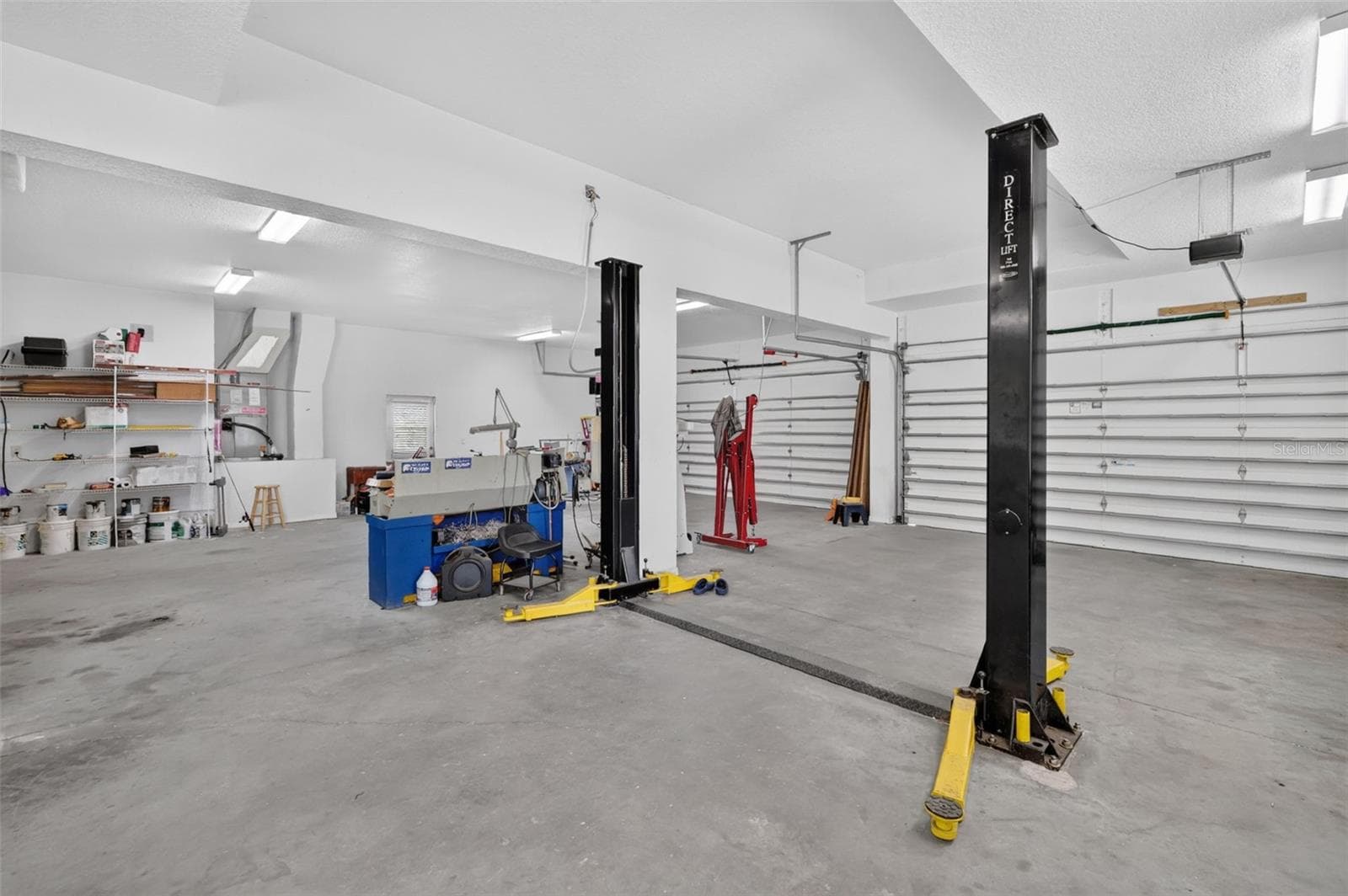 With room for 4+ vehicles plus a full machine shop, this outbuilding alone sets this property apart from anything else on the market. - 4617 ROUND LAKE RD, APOPKA