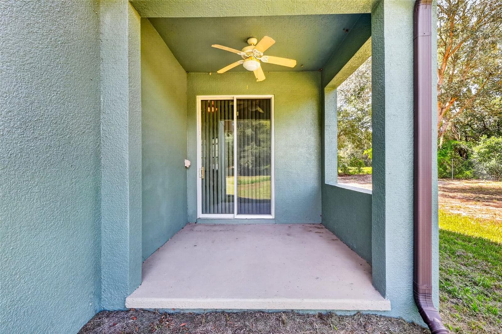 Step directly from the primary suite onto your own private covered patio, the perfect spot for morning coffee. - 4617 ROUND LAKE RD, APOPKA