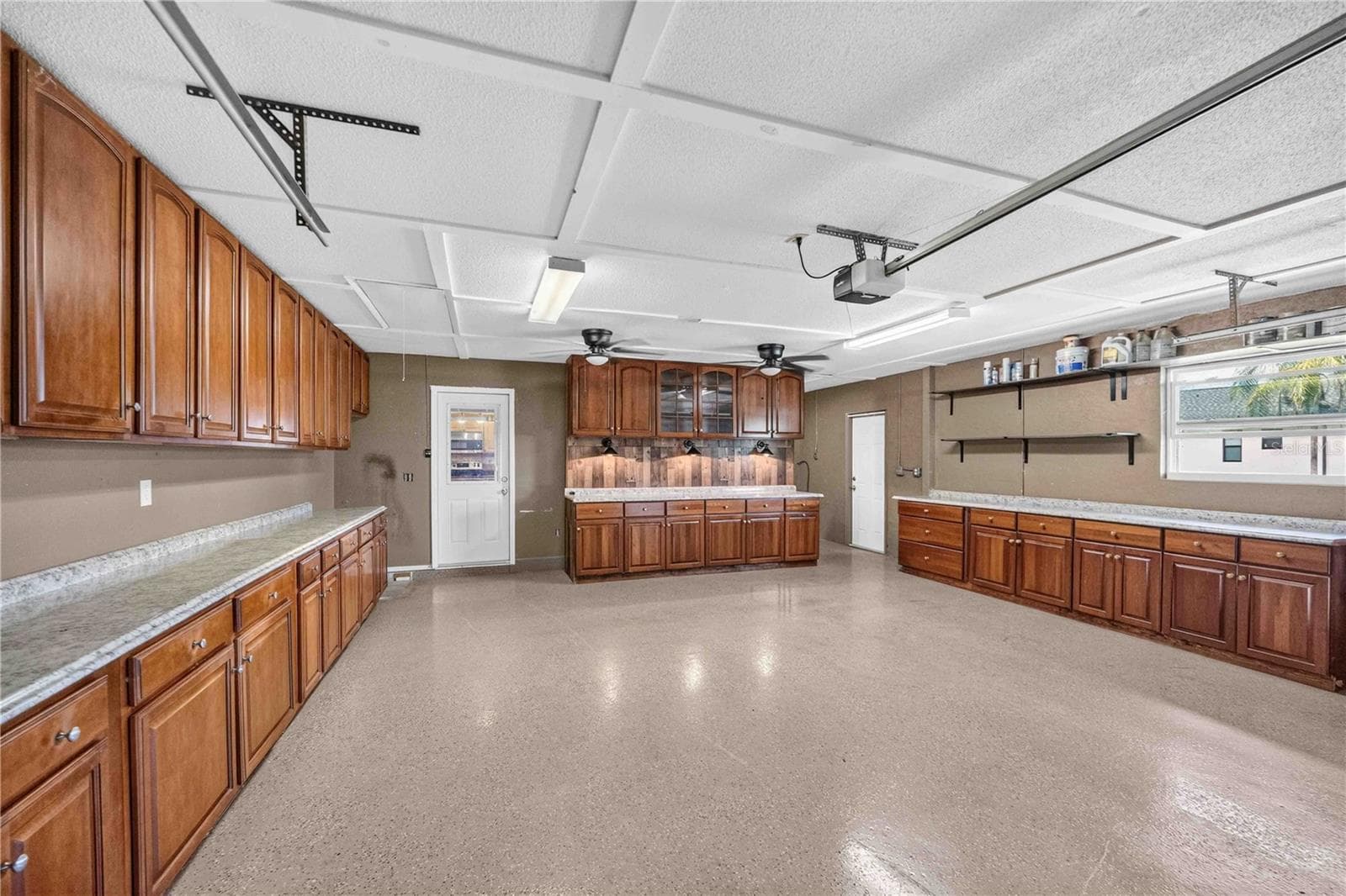 2 Car Garage with Epoxy Flooring, Built in Cabinetry & Attic Access. - 166 MARK TWAIN LN, ROTONDA WEST