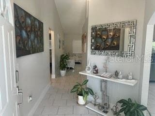 FRONT DOOR ENTRANCE AND HALL TO LIVING AREA - 3550 S SUMTER BLVD, NORTH PORT