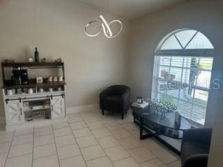 PARTIAL VIEW OF THE LIVING ROOM TOWARD FRONT WINDOW AREA - 3550 S SUMTER BLVD, NORTH PORT