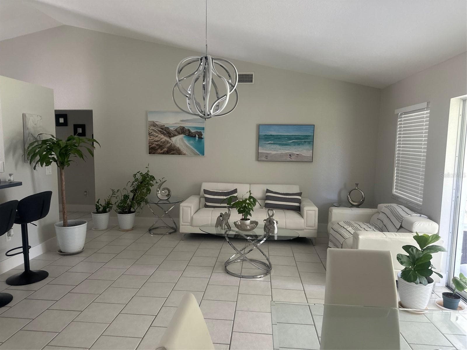 PARTIAL VIEW OF THE FAMILY ROOM FROM EAT IN KITCHEN AREA - 3550 S SUMTER BLVD, NORTH PORT