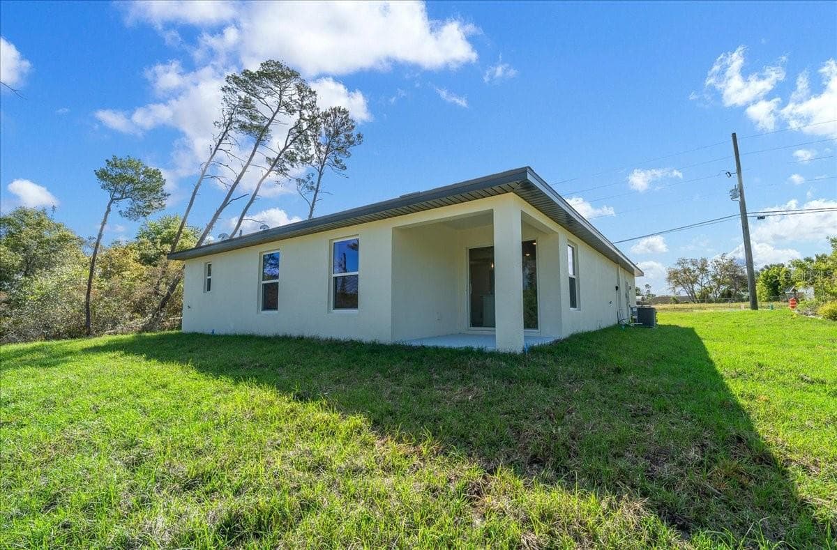 Rear Exterior & Covered Patio - 6241 FREEPORT DR, SPRING HILL