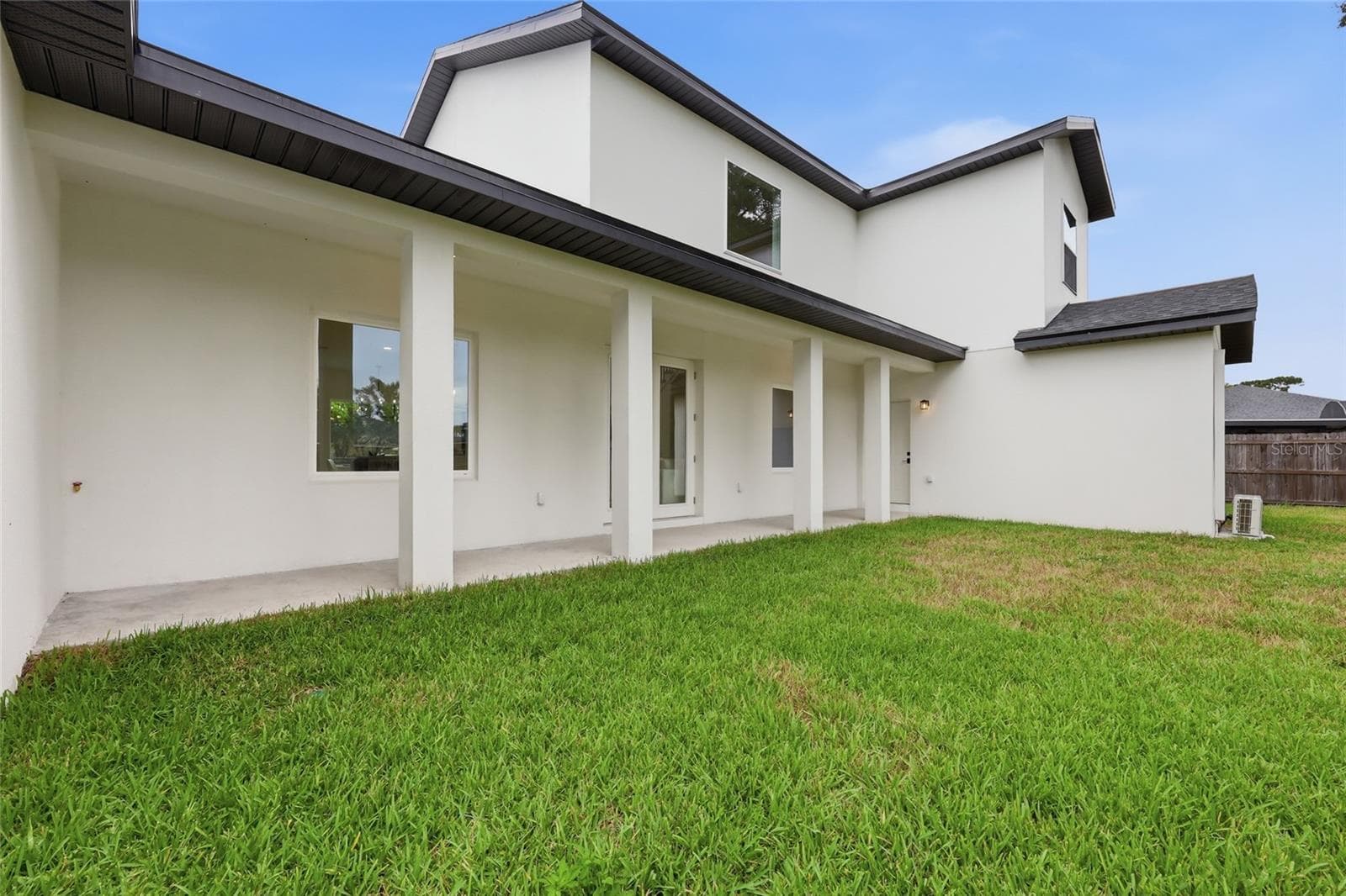 Side exterior of house - 351 E WILDMERE AVE, LONGWOOD