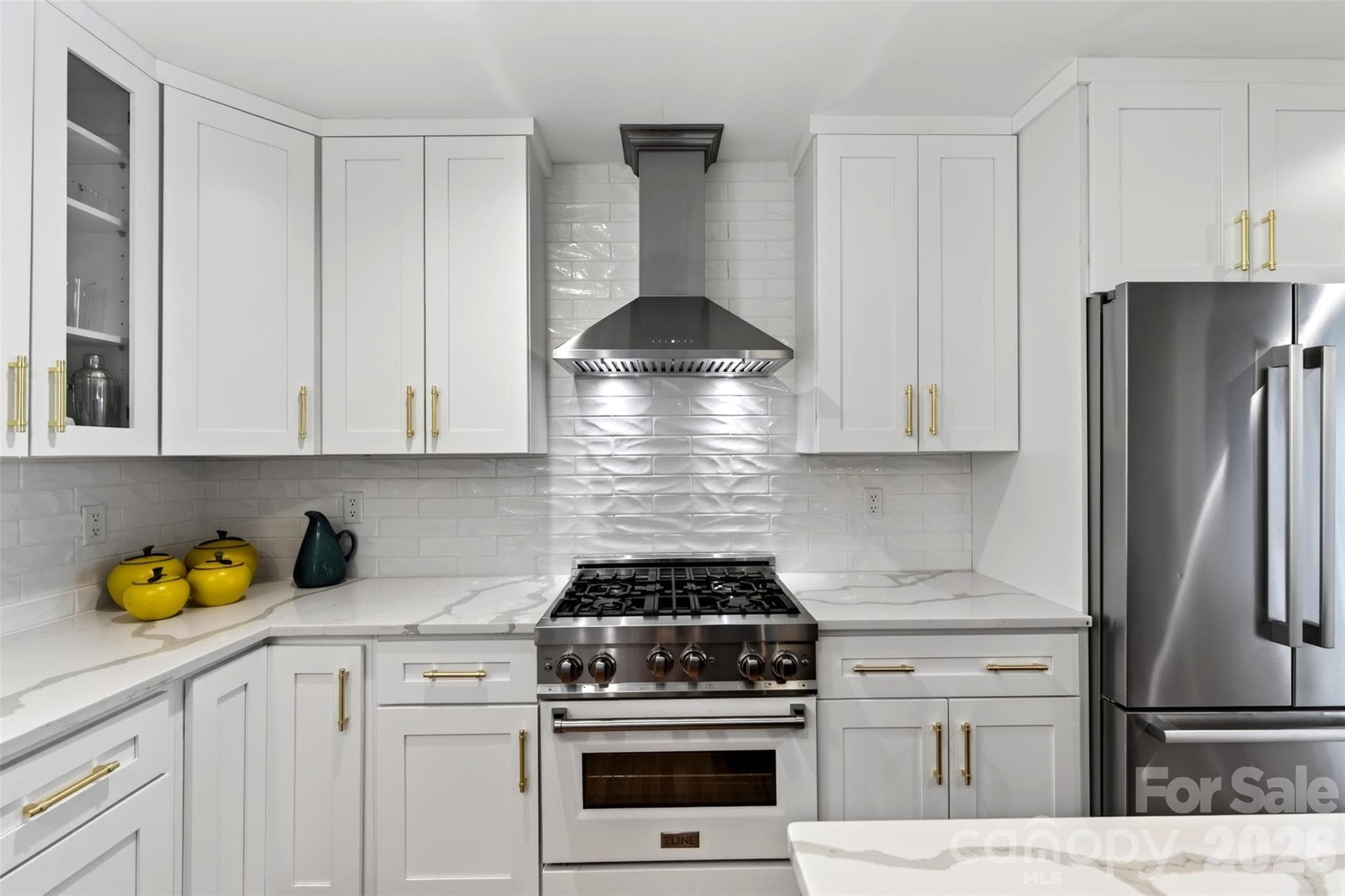 Kitchen with custom cabinetry, range & refrigerator - 55 Edgemont Road, Asheville