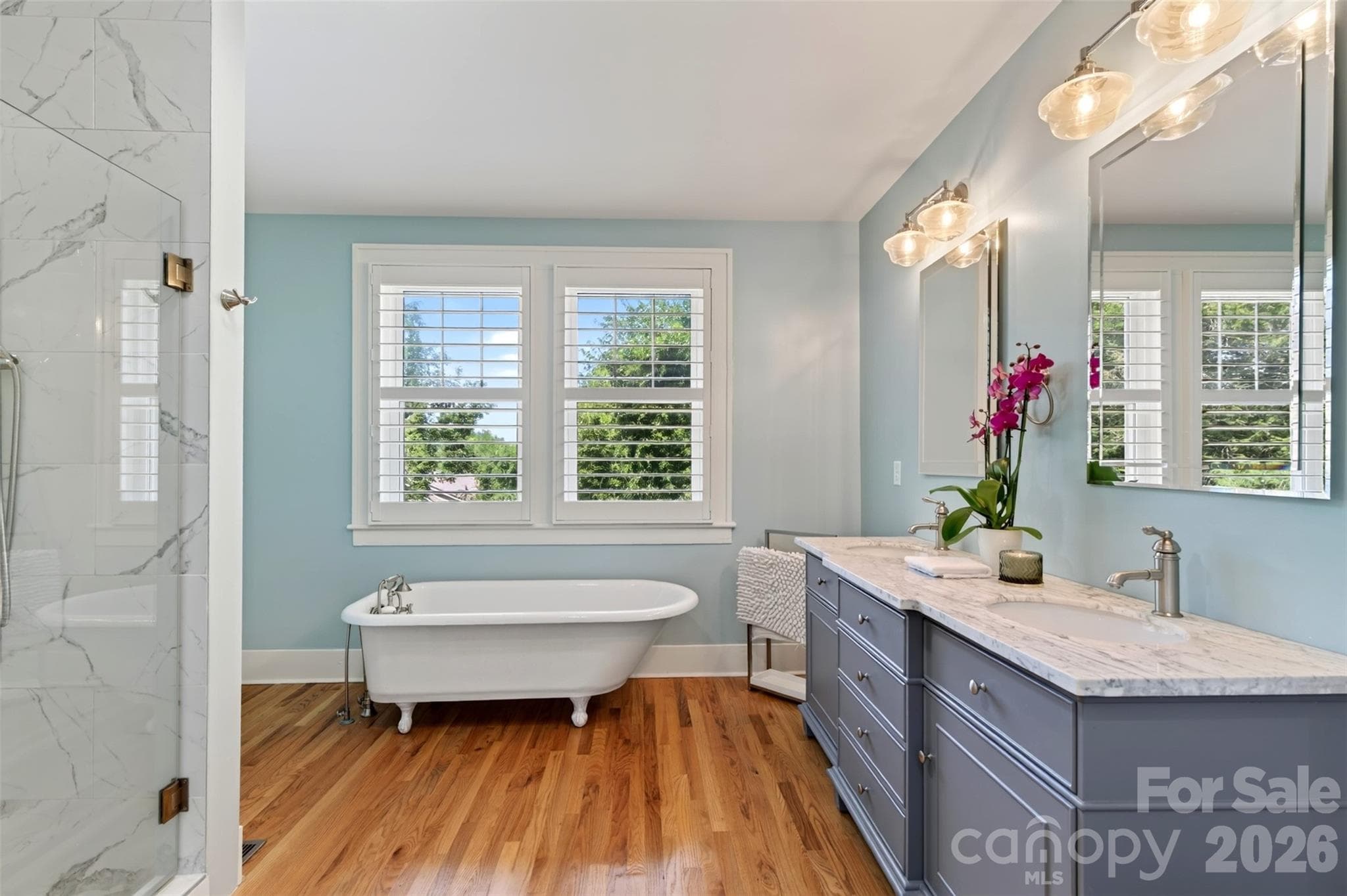 Primary bedroom bath overlooking terraced back yard - 55 Edgemont Road, Asheville