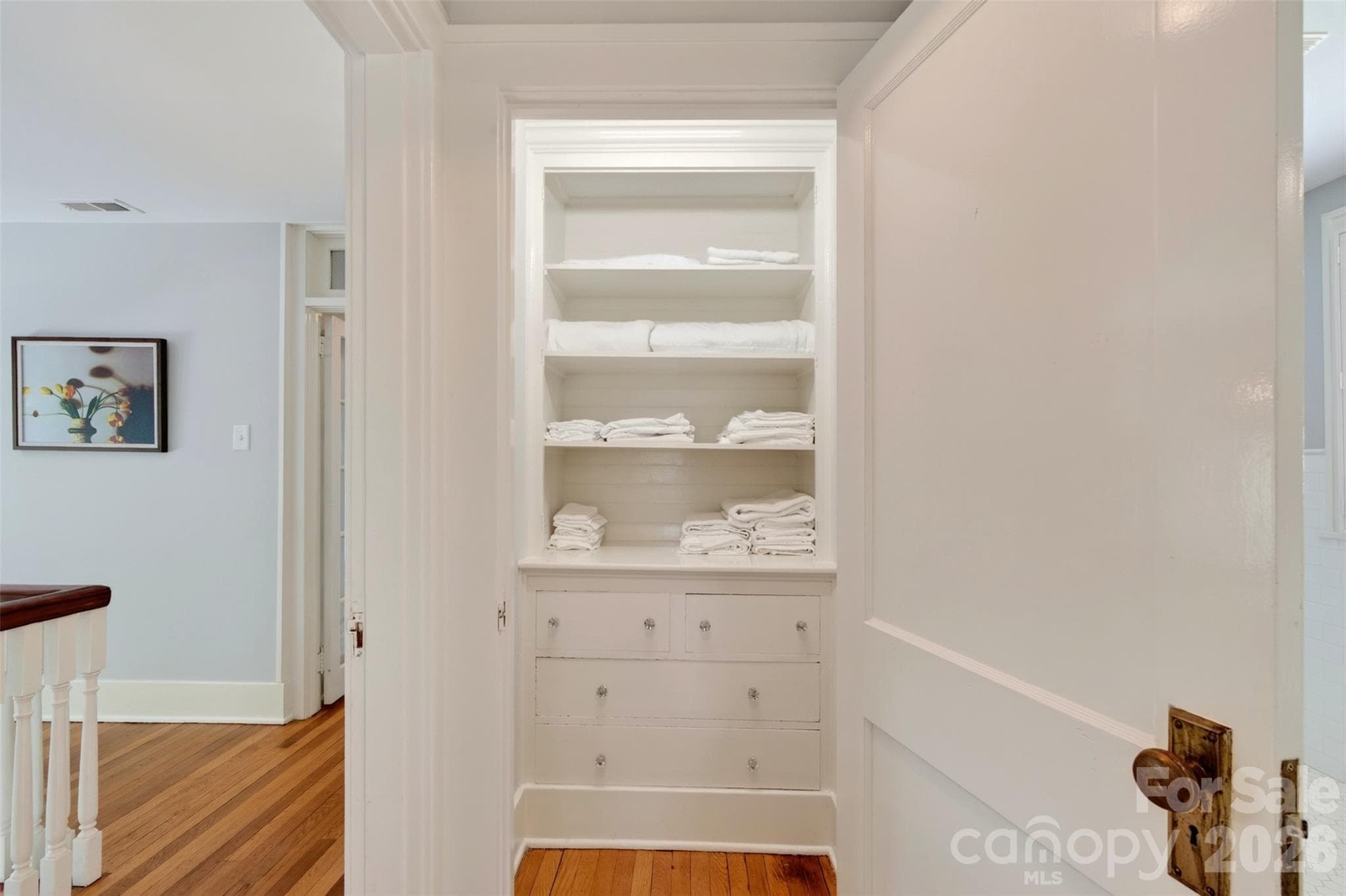 upper level primary bedroom built in linen closet - 55 Edgemont Road, Asheville