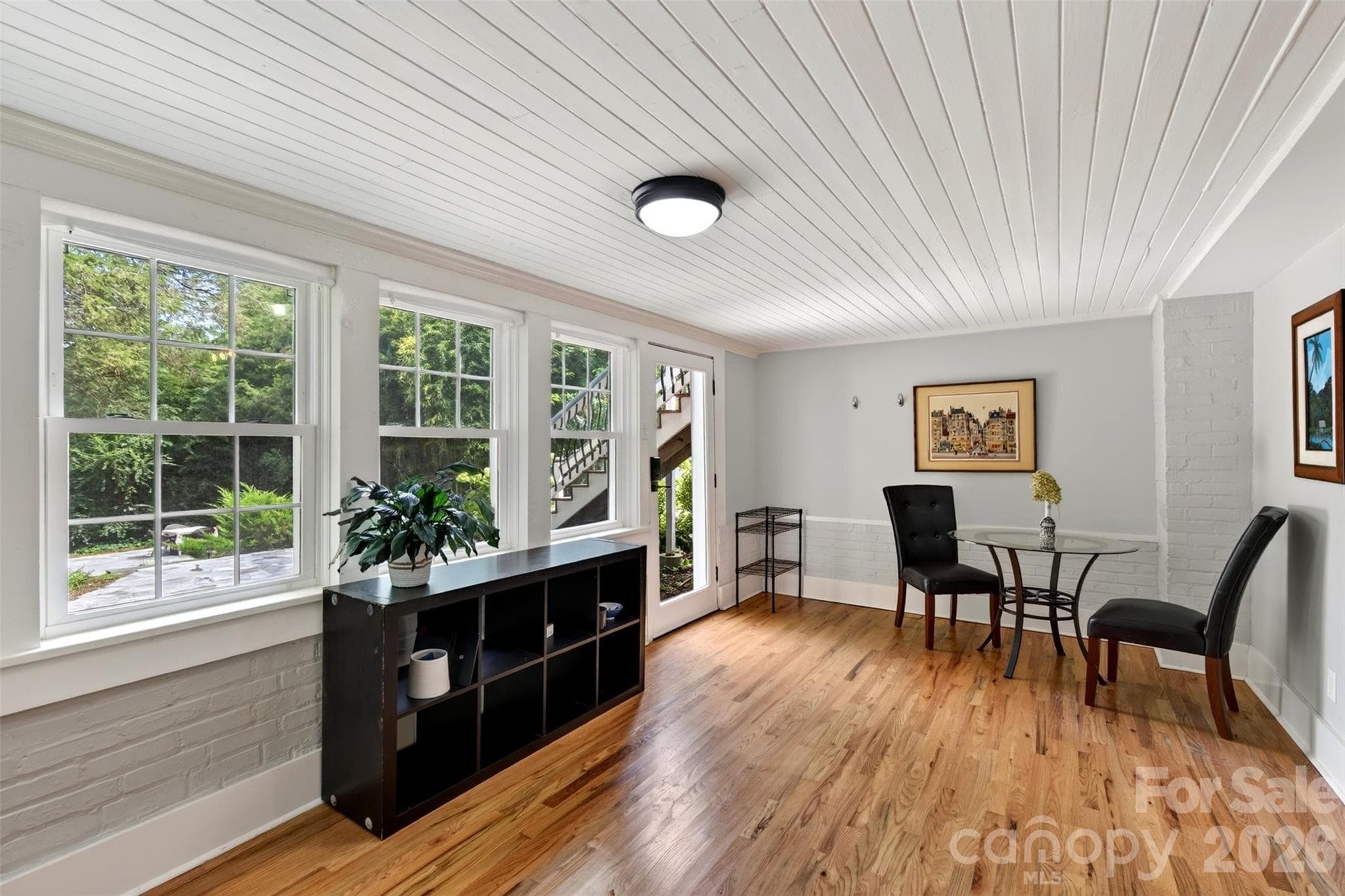Lower level living room with entry to back terraced yard - 55 Edgemont Road, Asheville